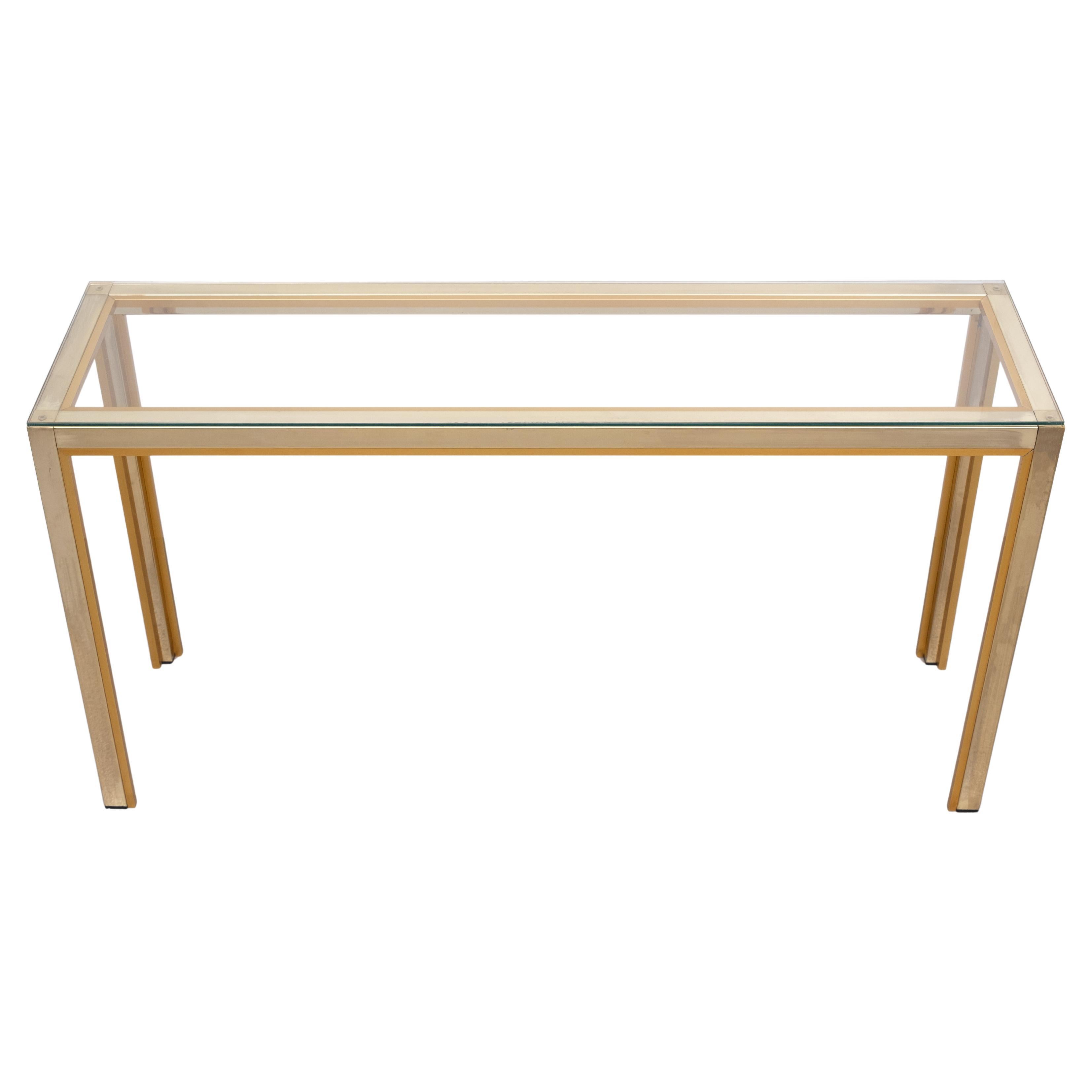 Very nice Console table ,Two colors. Brass and Copper ,comes 
with a Glass top . Good condition . 
Design by Renato Zevi  for Romeo Rega  1970s Italy .