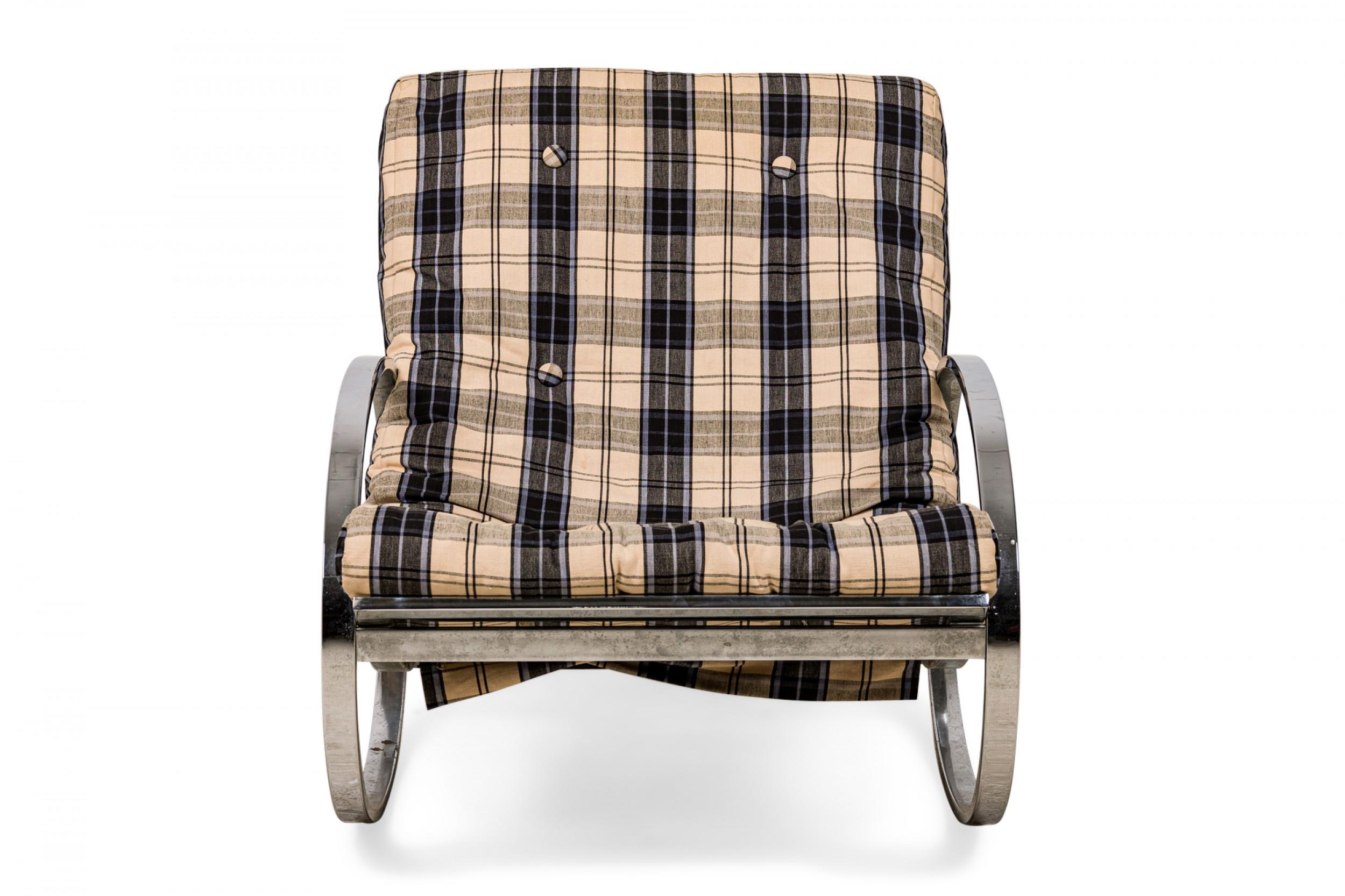Italian mid-century (circa 1970) ellipse-form rocking chair with a polished chrome frame with rockers and arms composed of the same elliptical pieces on either side, upholstered in a beige, black, and blue plaid fabric with button tufted detail.