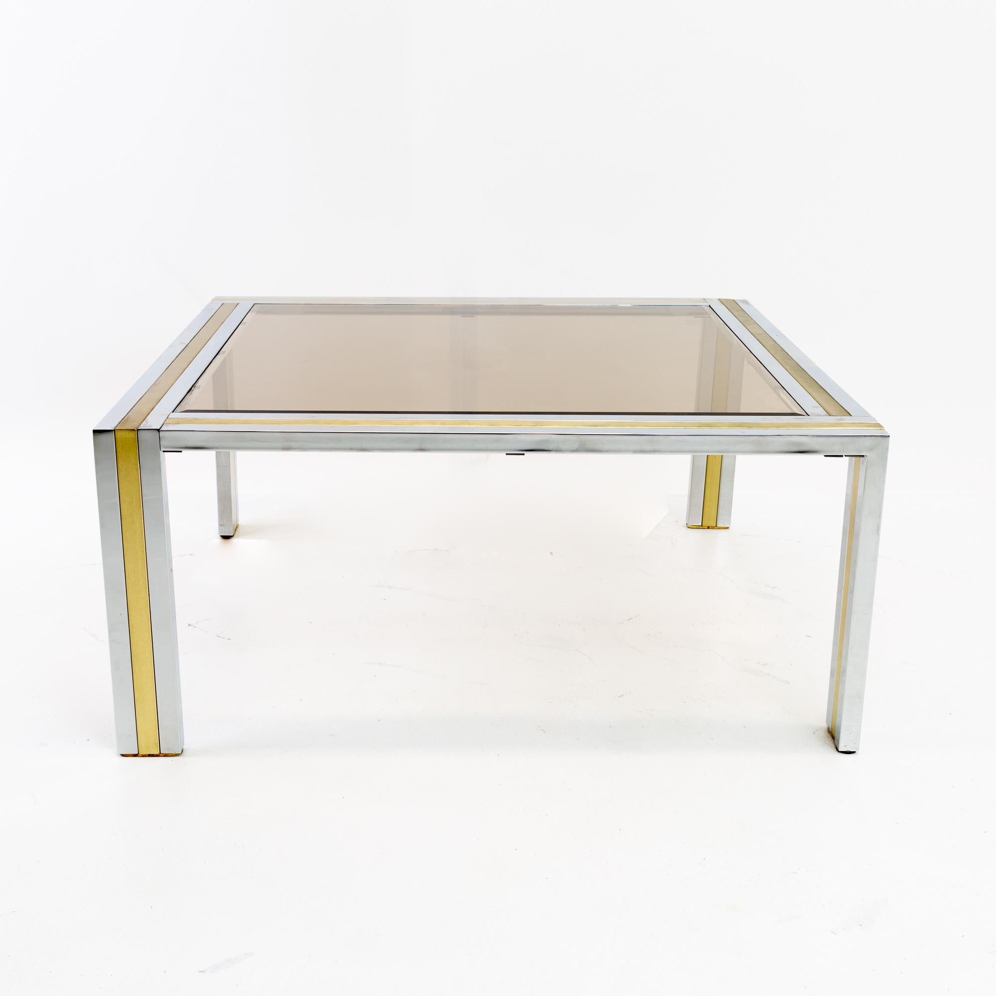 Renato Zevi Italian Mid Century chrome brass and glass square coffee table
This table is 36 wide x 36 deep x 16 inches high

This price includes getting this piece in what we call restored vintage condition. That means the piece is permanently fixed