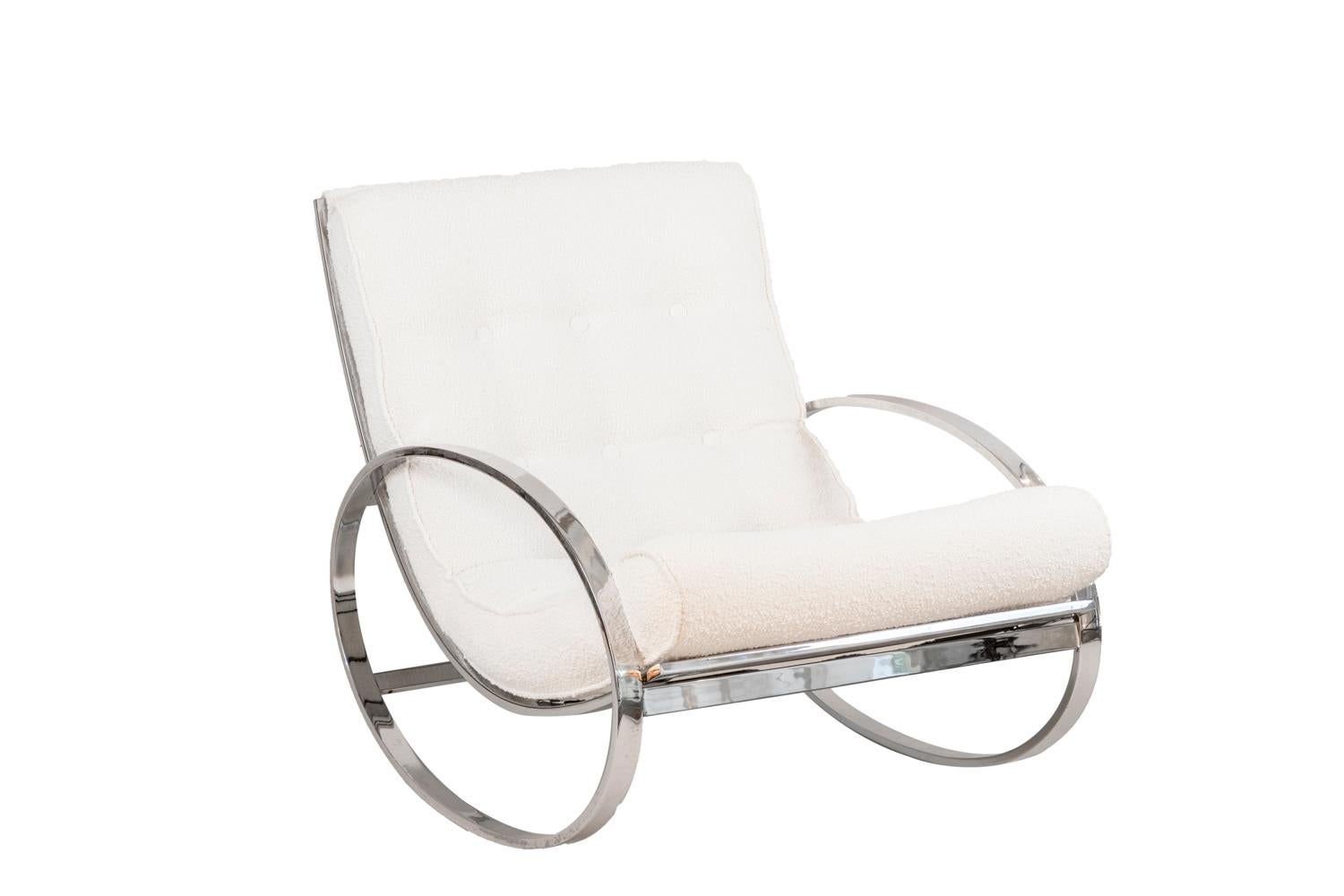 Renato Zevi, attributed to.
Pair of Ellipse rocking-chairs in chromed metal. Rectangular shape arm in oval shape. Seat and back with a bronze structure of transversal bars supporting a quilted cushion attached to the metal structure top by snap