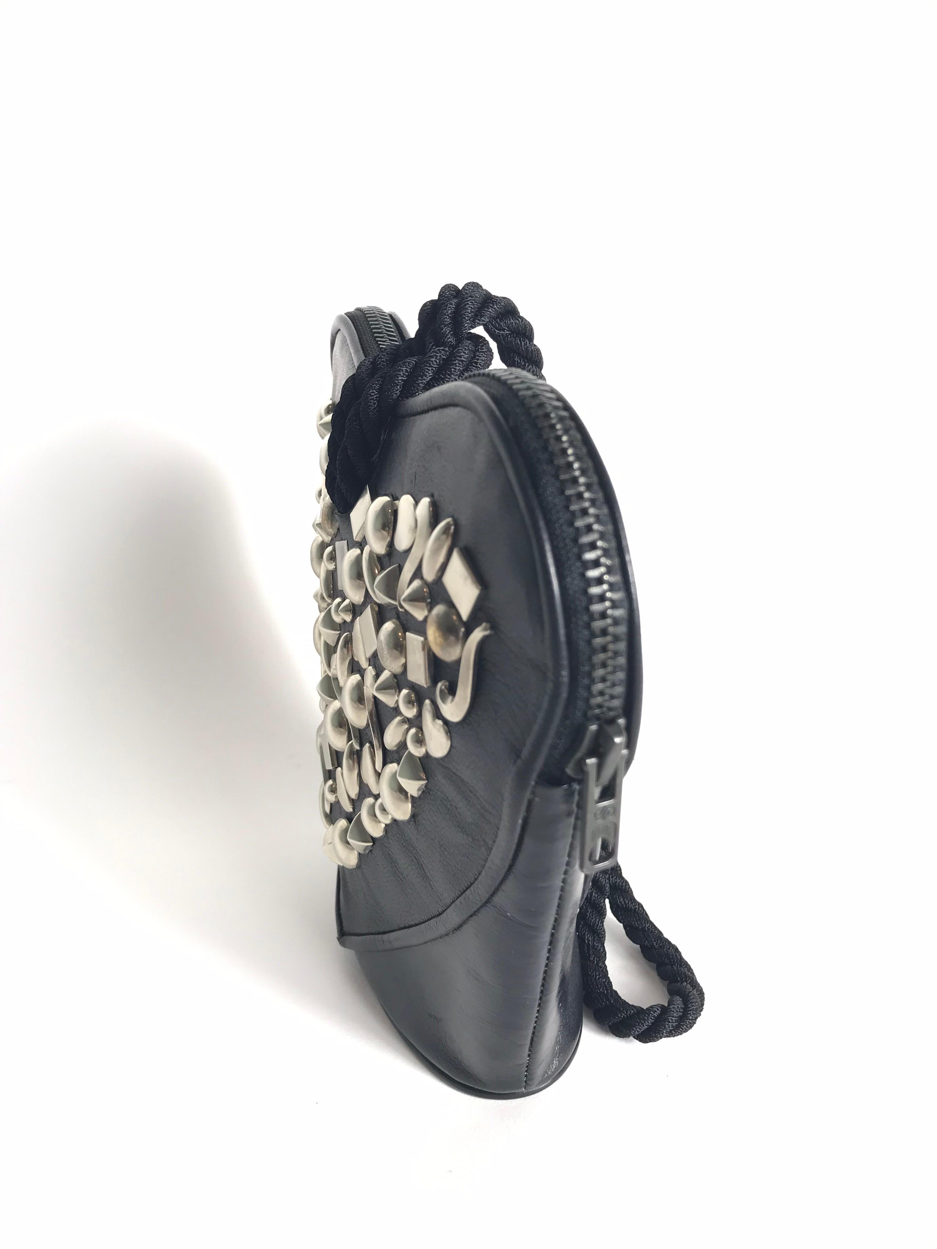 RENAUD PELLEGRINO black leather heart shaped studded small bag with cord strap. Condition: Excellent 