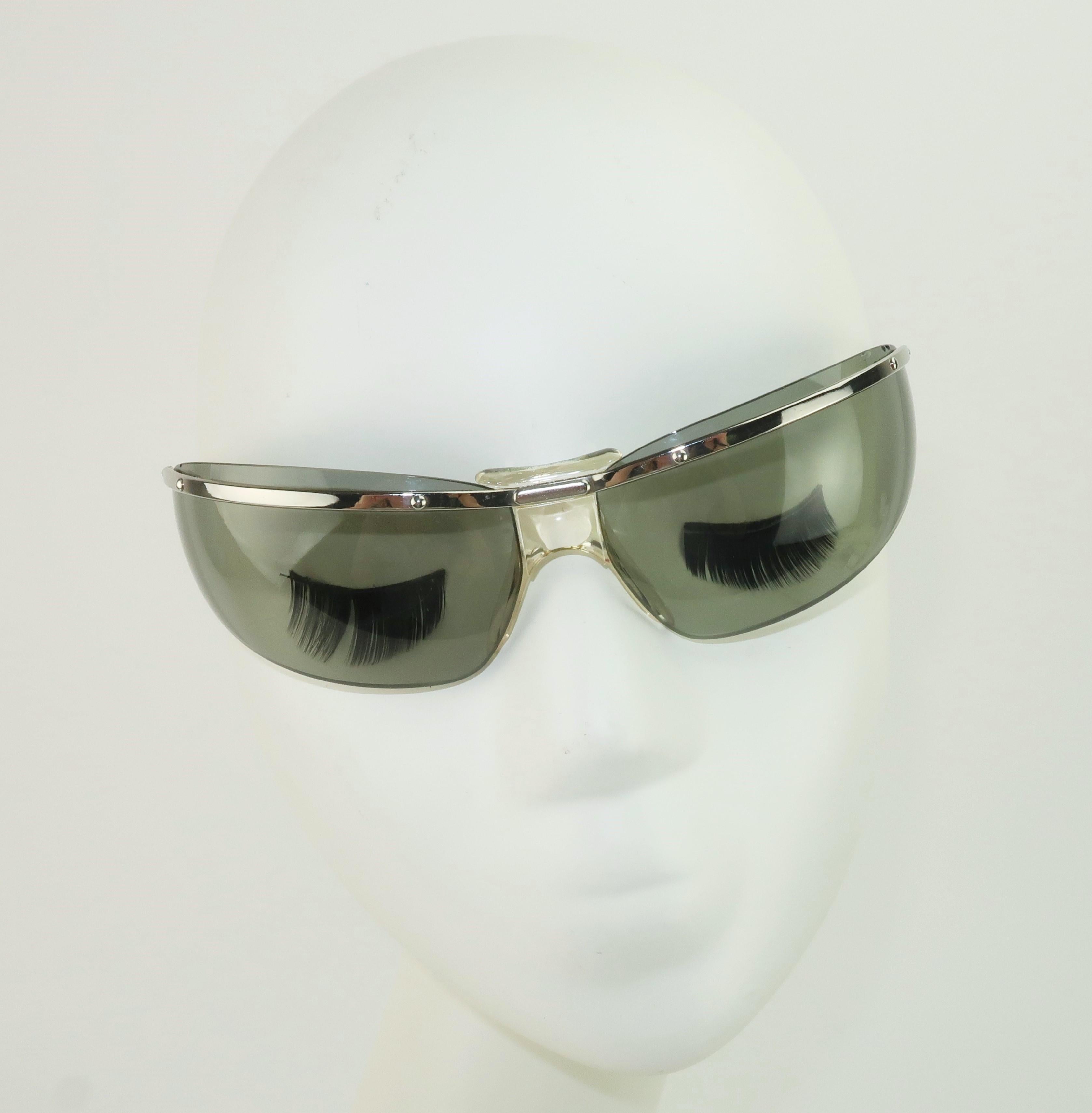 This sporty design may be de rigueur in contemporary eye wear but in the 1960's Renauld of France made a splash with wrap around sunglasses.  Popular among sports enthusiasts including skiers and race car drivers, the space age shape proved both