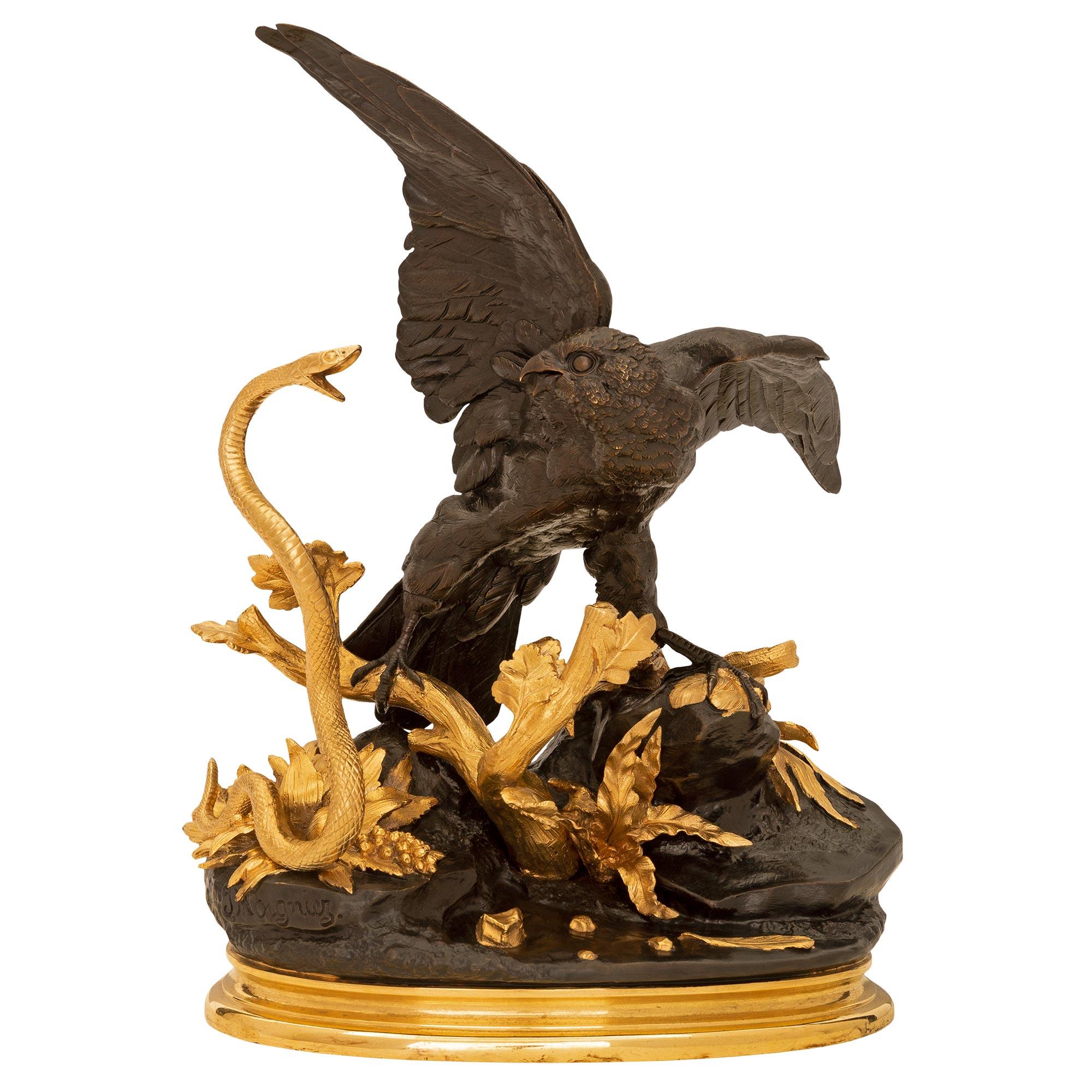 Statue en bronze patiné et bronze doré de style Louis XVI, signée par Jules Moigniez, d'une qualité exceptionnelle. La statue est surmontée d'une élégante base oblongue en bronze doré tacheté, sous le motif en bronze patiné merveilleusement exécuté,