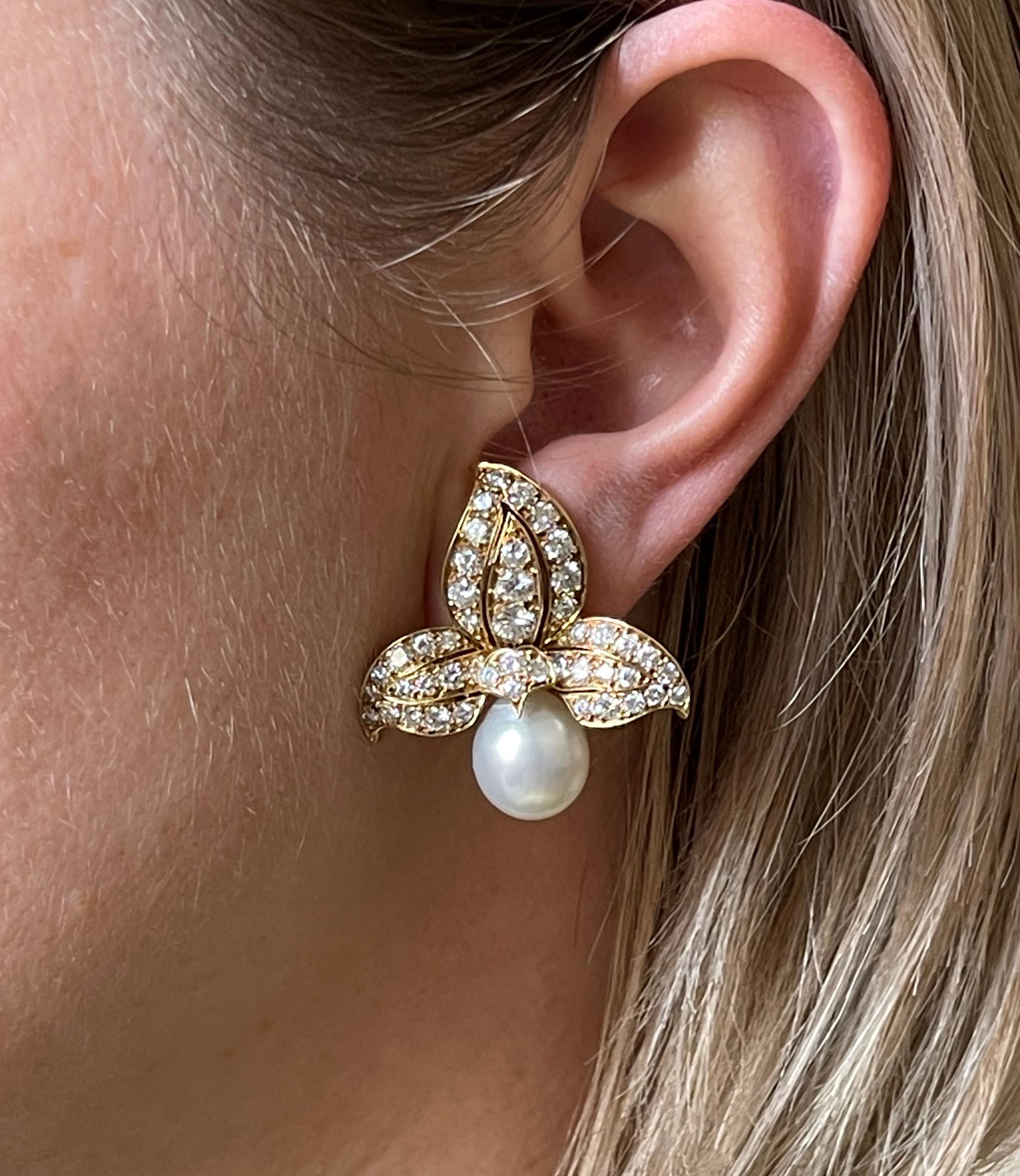 Pair of exquisite Rene Boivin 18k gold cocktail earrings, set with 11mm x 12.5mm South Sea pearls, and approx. 4.40ctw F/VVS diamonds. Earrings measure 1 5/16