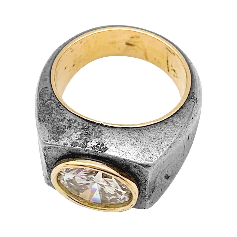A 18kt yellow gold ring signed René Boivin coated with 925/000 silver and centered with a brilliant cut diamond circled with 18kt yellow gold. 
Signed and maker hallmark
US Size : 4 not sizeable (47) 
Diamond's weight : 2,96 carats    Diamond's