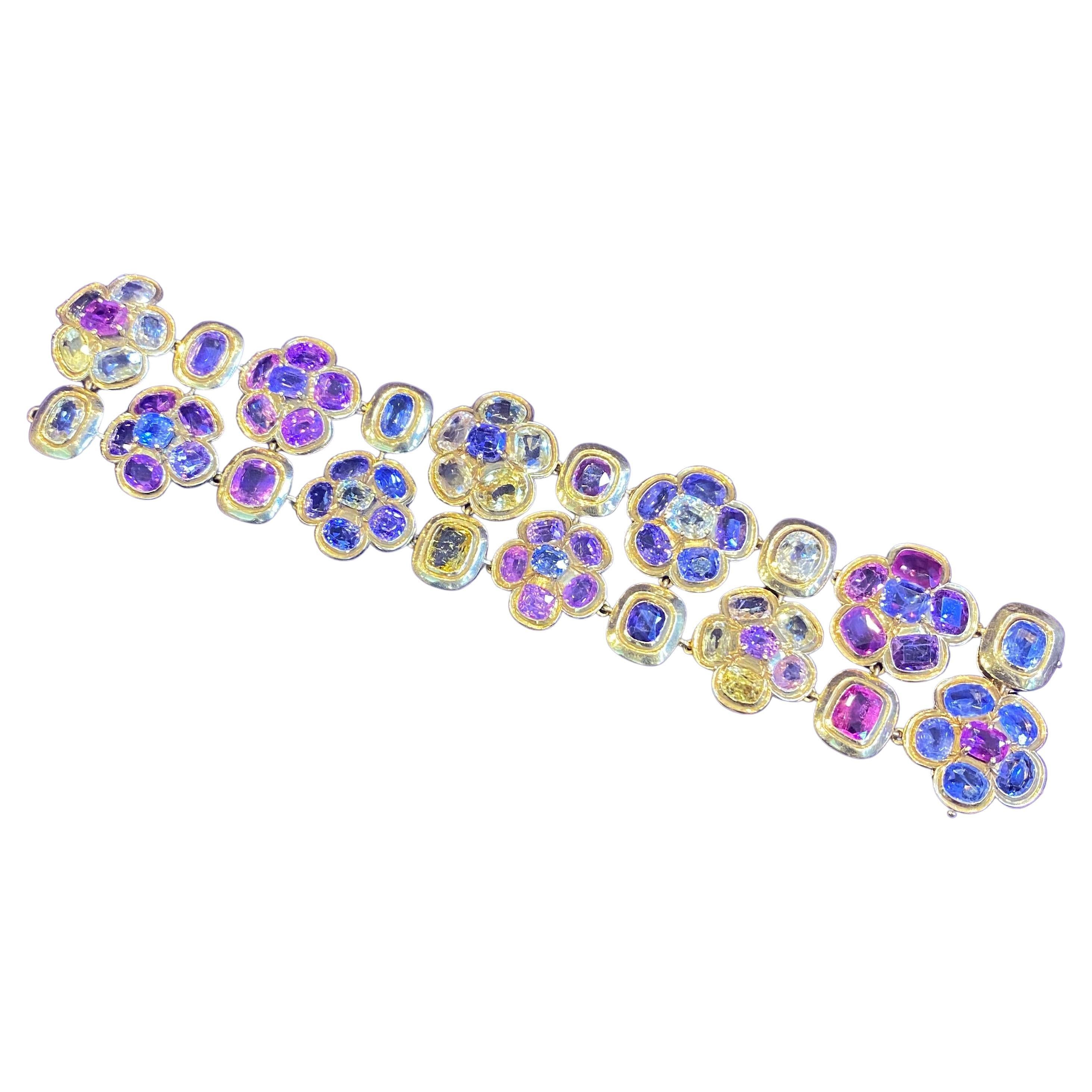 Rene Boivin Sapphire bracelet. Of floral design, set with 70 cushion and oval-shaped sapphires of various colors

Length 7½ inches

French assay and maker's marks.

Provenance:
For a parure of similar design, see Rene Boivin Joaillier, by Françoise
