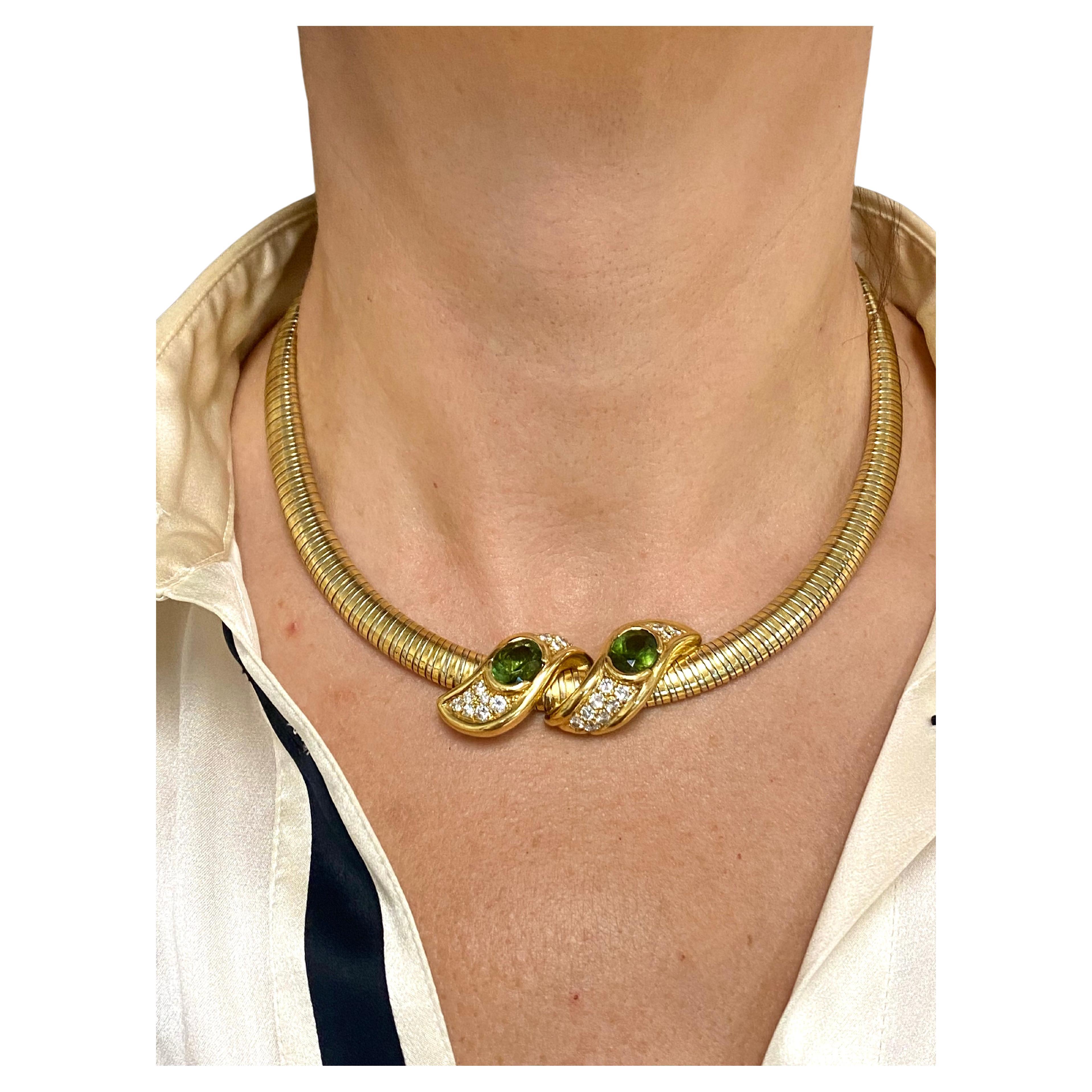 DESIGNER: René Boivin
CIRCA: Late 20th Century
MATERIALS: 18K Yellow and White Gold
GEMSTONE: Peridot, Diamond 
WEIGHT: 68.6 grams
MEASUREMENTS: 17” x 5/16” 
HALLMARKS: René Boivin

A unique vintage necklace by Rene Boivin of Tubogas design. Made of