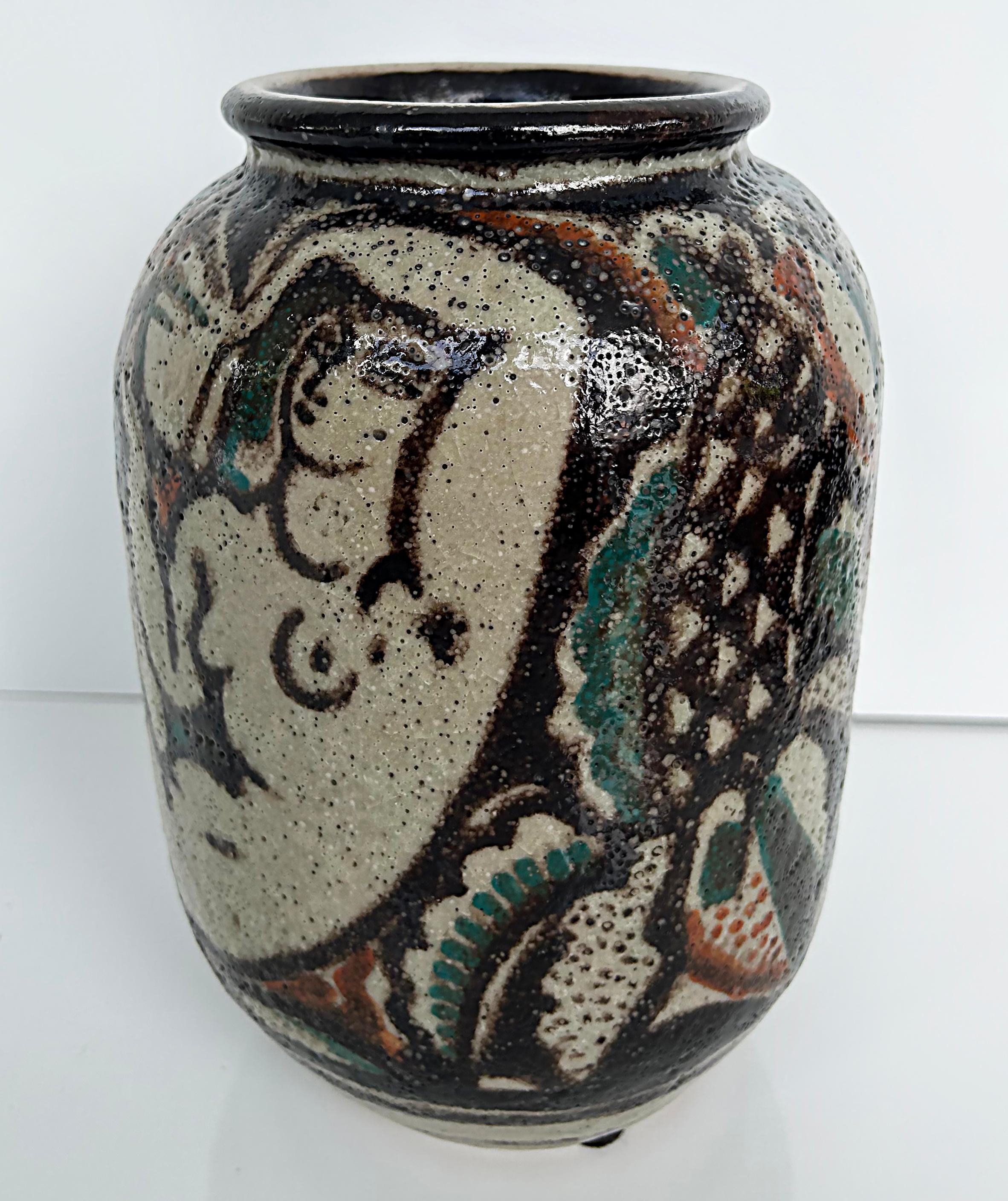 Rene Buthaud French Ceramist Vase with Nude Figures

Offered for sale is a vase with nude figures by the French Ceramist René Buthaud (1886-1986). The vase has a textured glaze finish and is signed by the artist on the base as shown. The mark is