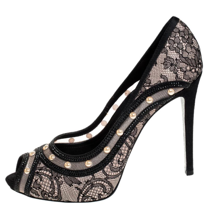 Have everyone talking about your amazing sense of style in this pair of pumps from René Caovilla. A gorgeous pair of lace, mesh and satin, these pumps are exclusively made for you. They have an open toe silhouette, crystal and pearl embellishments,