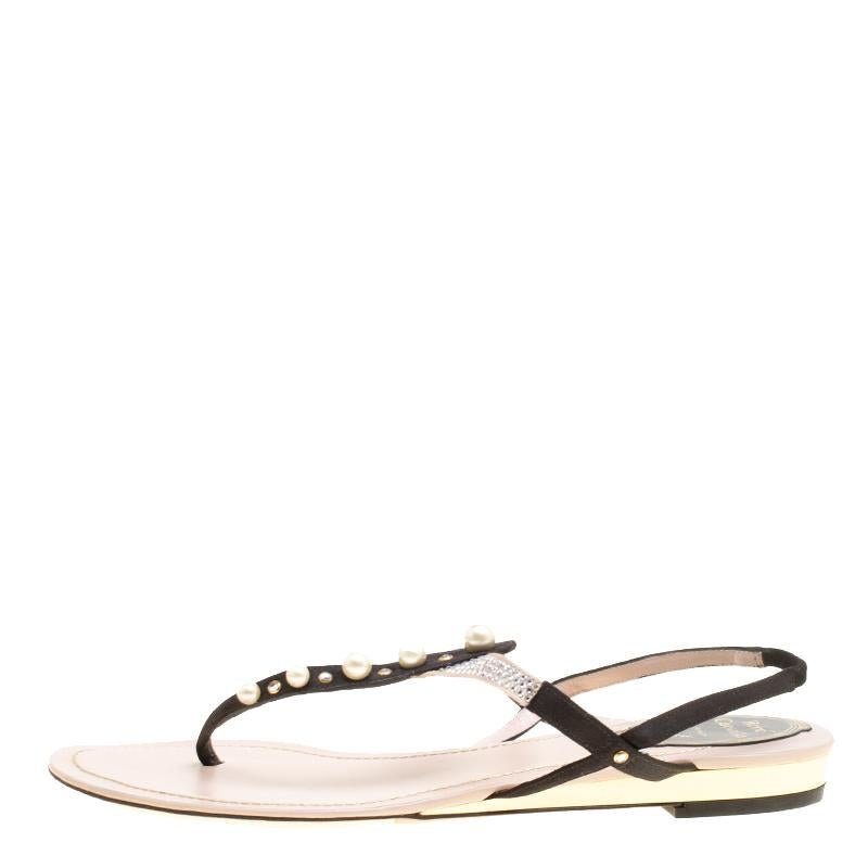 These flat sandals from Rene Caovilla look very beautiful and are perfect for the fashionable you! The black and beige sandals are crafted from satin and feature a thong design. They flaunt a lovely pearl embellished strap and slingbacks. They come