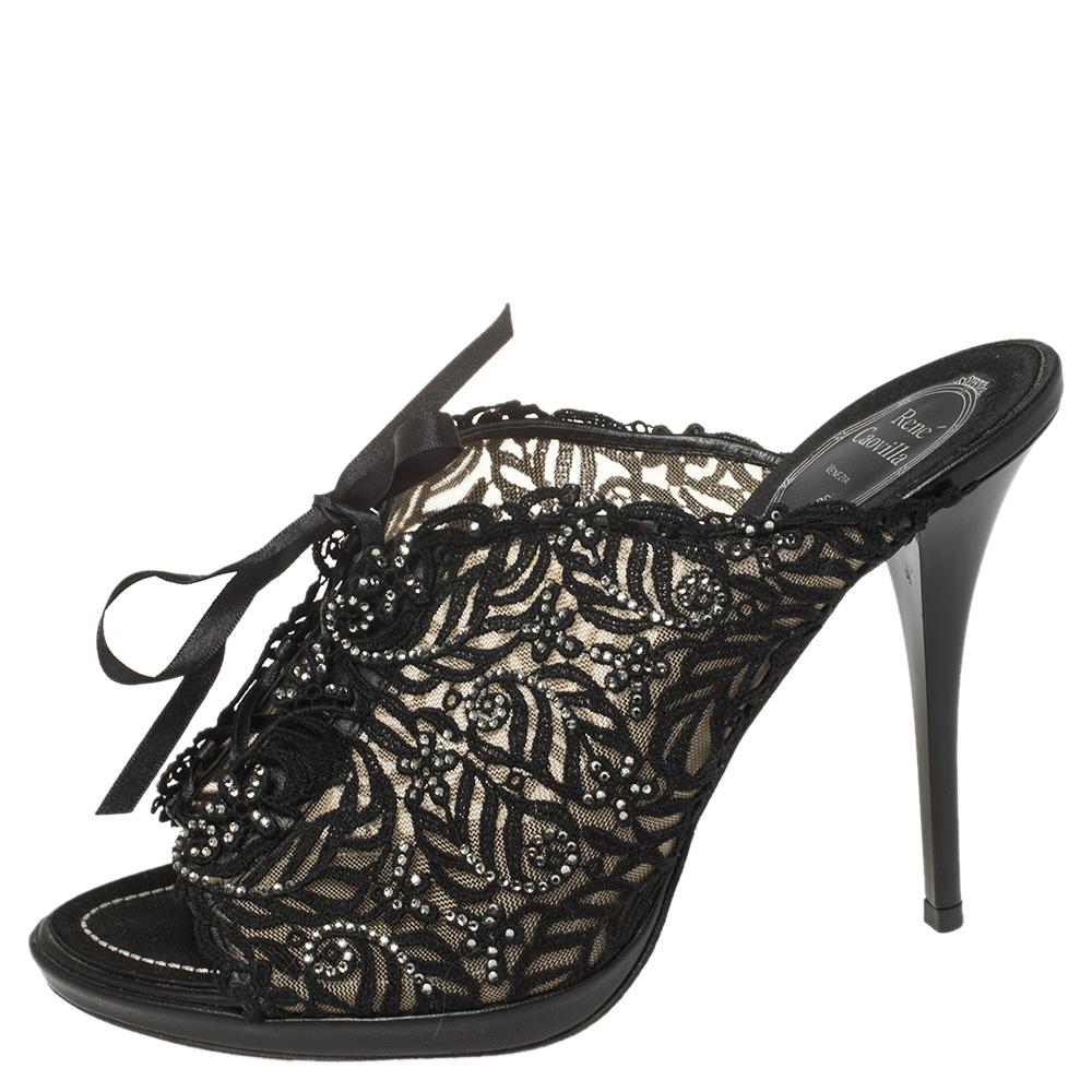 These stunning sandals by René Caovilla are the epitome of sophistication and femininity. Crafted in Italy into an open-toe silhouette, they are made from intricate lace and have ties on the vamps. They come in a classic shade of black and are