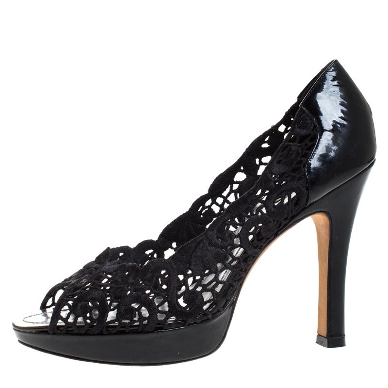 These stunning pumps by René Caovilla are the epitome of sophistication. Crafted in Italy, they are made from intricate lace and patent leather. They come in a classic shade of black and will complement a hot of outfits. They are styled with peep
