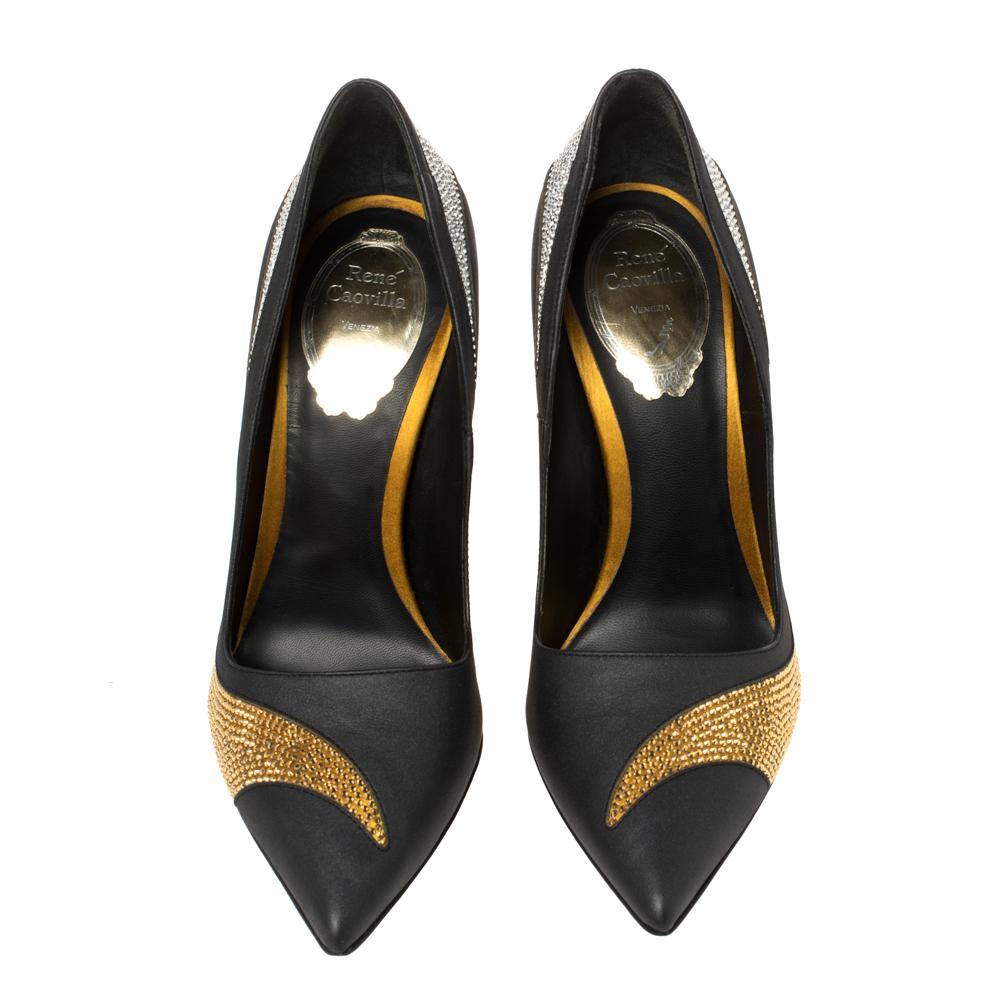 Walk with grace and confidence in these gorgeous pumps by René Caovilla. Styled in black satin and leather with dazzling crystal embellishments, pointed toes, and leather insoles to provide comfort, these pumps will never fail to lift your outfits.