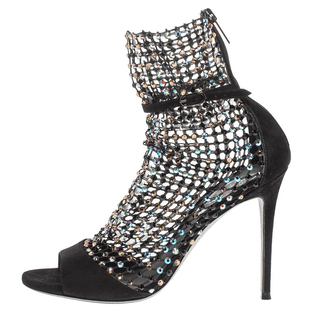 These spell-bounding sandals, called Galaxia are from the coveted label Rene Caovilla. Juxtaposed with black suede vamps is a crystal-embellished mesh exterior rendered in sock-like silhouette, and is secured with a buckled strap across the ankle in