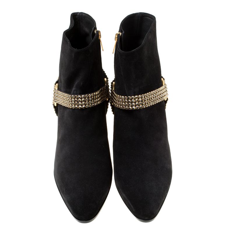 These Rene Caovilla ankle boots are anything but ordinary and are sure to add oodles of style to your wardrobe! The black boots have been crafted from suede and styled with pointed toes and crystal embellished straps and 5.5 cm block heels. They
