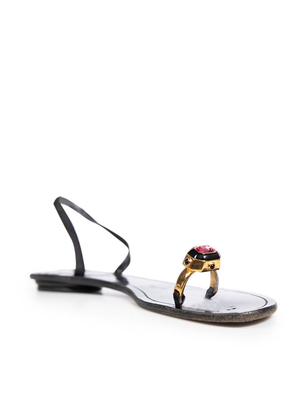 CONDITION is Good. General wear to the sandals is evident, there are overall indents on the insoles and general creasing to the leather on the upper insoles. The crystal on the ring detail is cracked on the right shoe and there discolouration on
