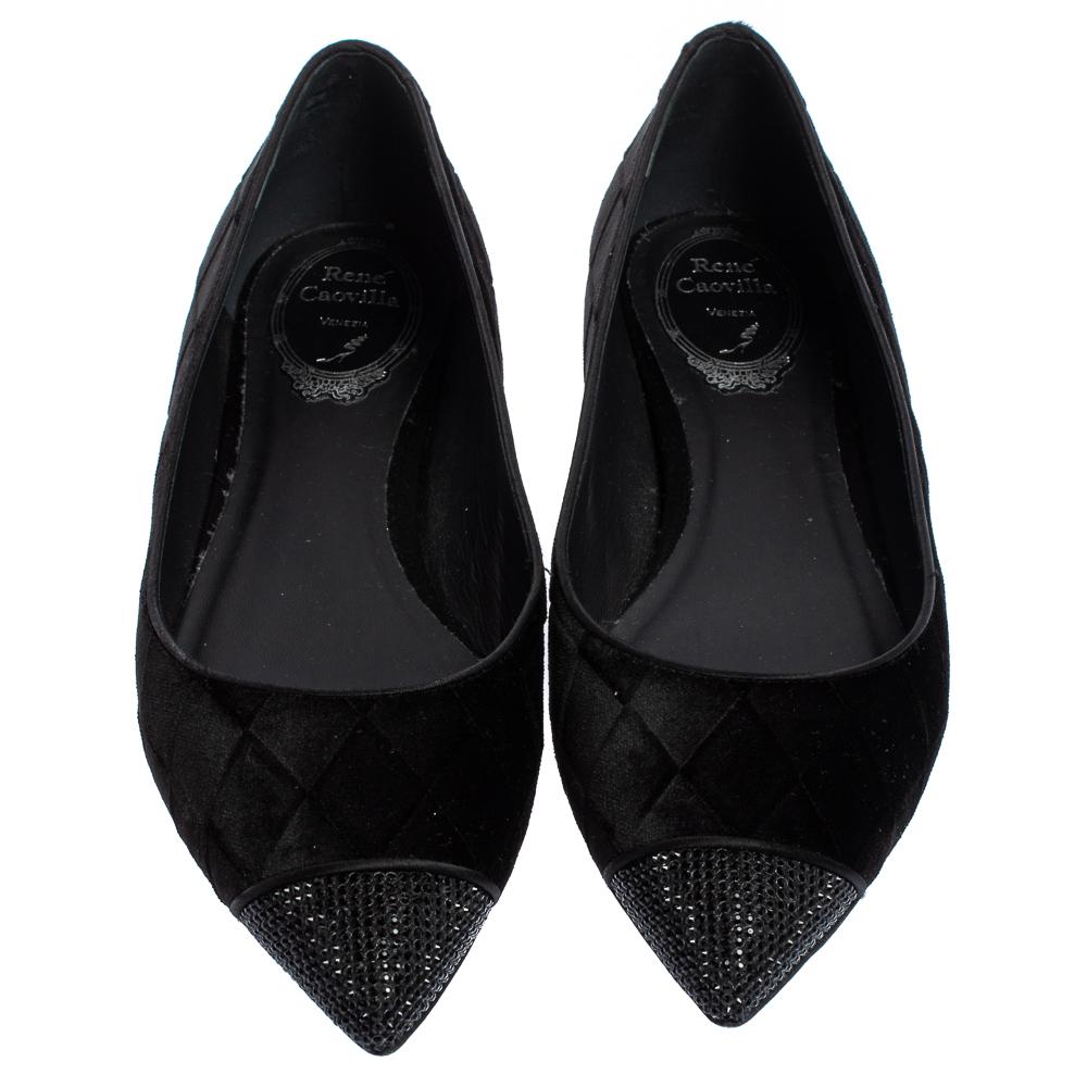 Lend the luxury appeal to your outfits with these chic ballet flats from René Caovilla. Crafted from black velvet and designed with pointed toes, they are the perfect choice when you want both comfort and fashion.

Includes: Original Dustbag,