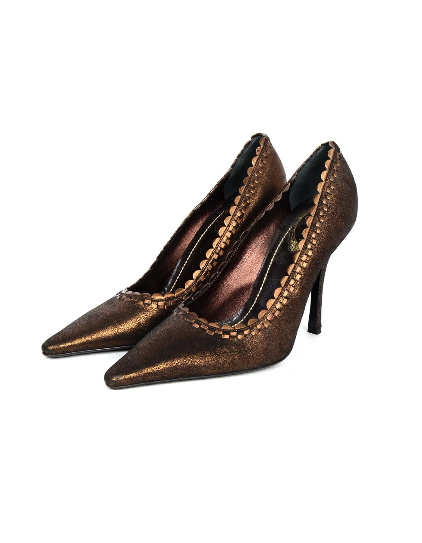 Rene Caovilla Bronze Leather Point Toe Pumps W/ Scalloped Edge Sz 38

Made In: Italy
Color: Bronze
Materials: Leather
Closure/Opening: Slide on
Overall Condition: Excellent pre-owned condition with excpetion of minor wear on toes and minor