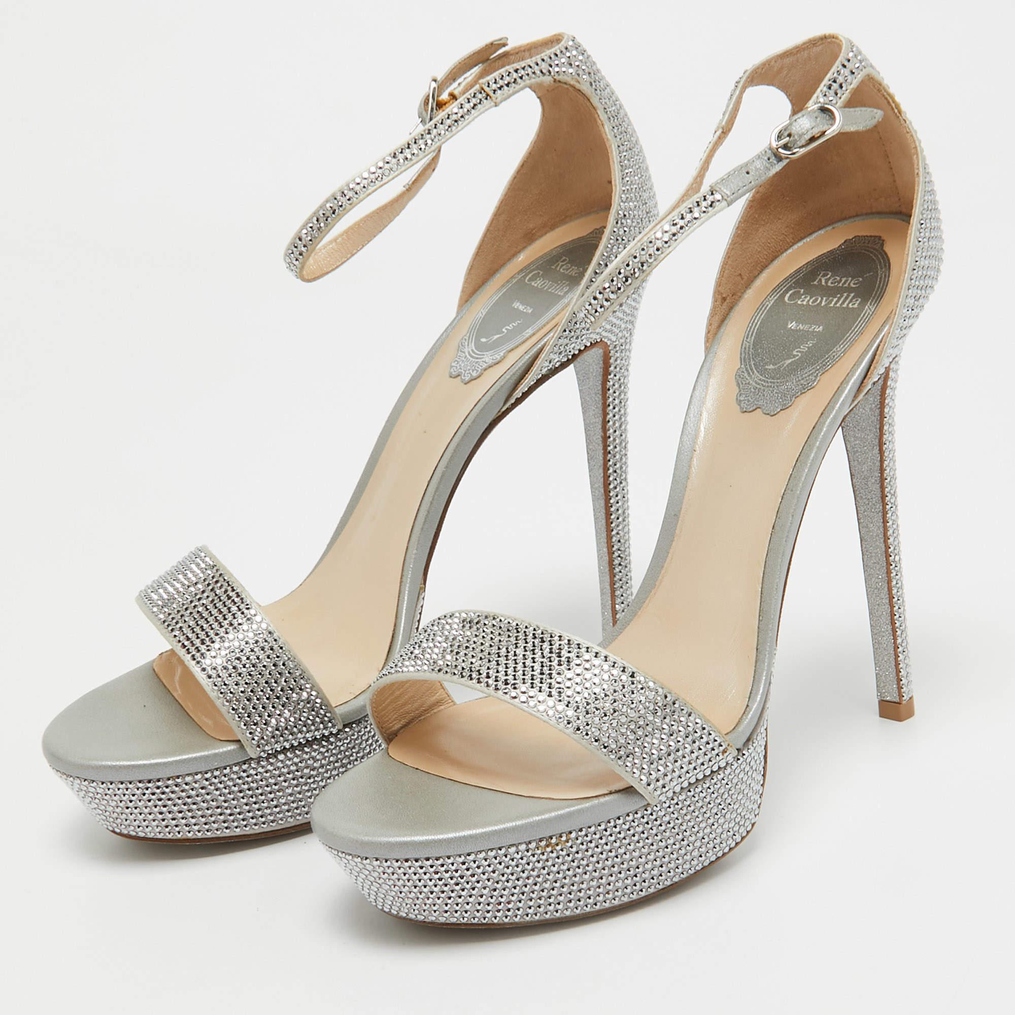 A gorgeous pair of sandals from the house of René Caovilla to highlight your fabulous styling choices. Crafted from embellished satin they feature open toes and come equipped with ankle fastening comfortable leather lined insoles and 14 cm heels.