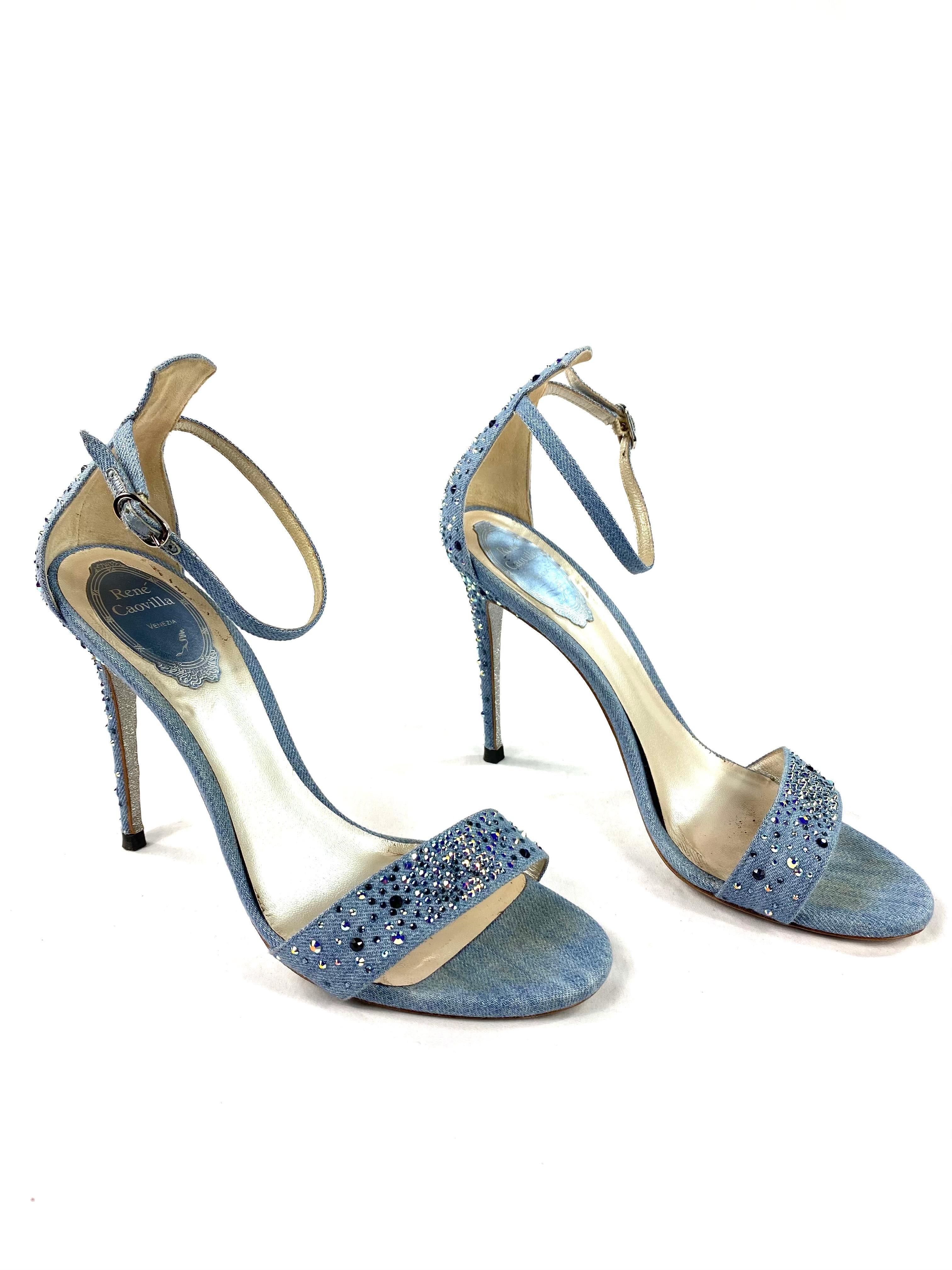 Product details:

Light blue wash denim with multiple shades of blue Swarovski crystals, strappy styled sandals with heel height 4.25