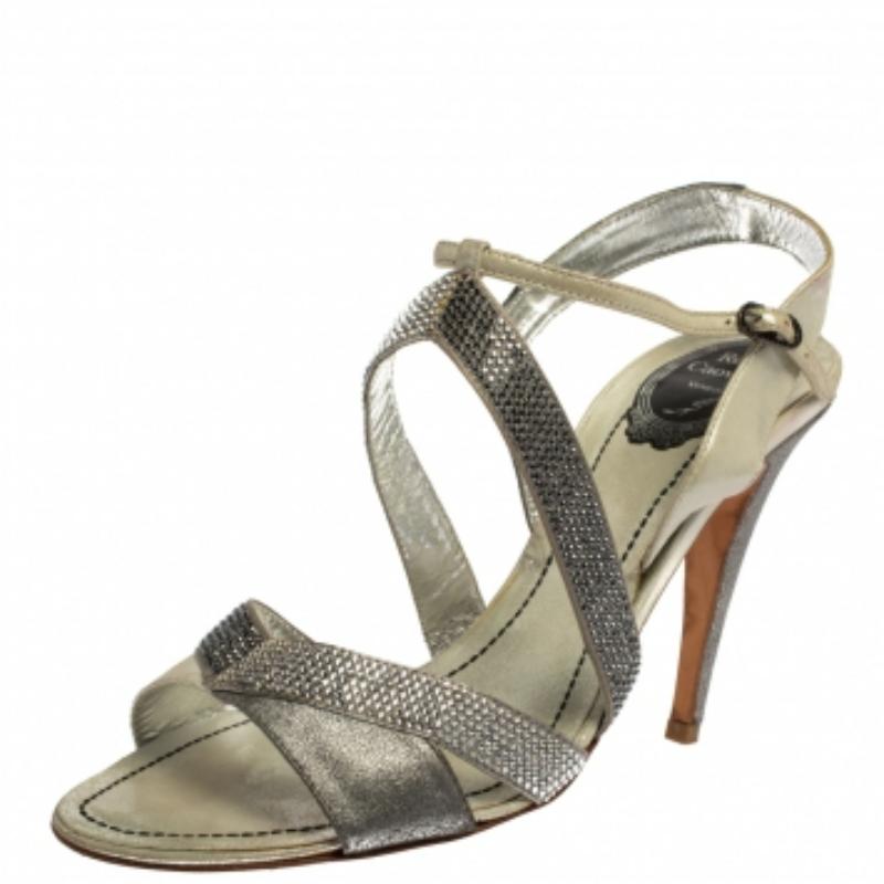 Exquisite, enchanting, and very stylish, these grey and silver sandals from Rene Caovilla are perfect for the fashionable you! They are crafted from satin, nubuck leather, and glitter and feature an open-toe silhouette. They flaunt