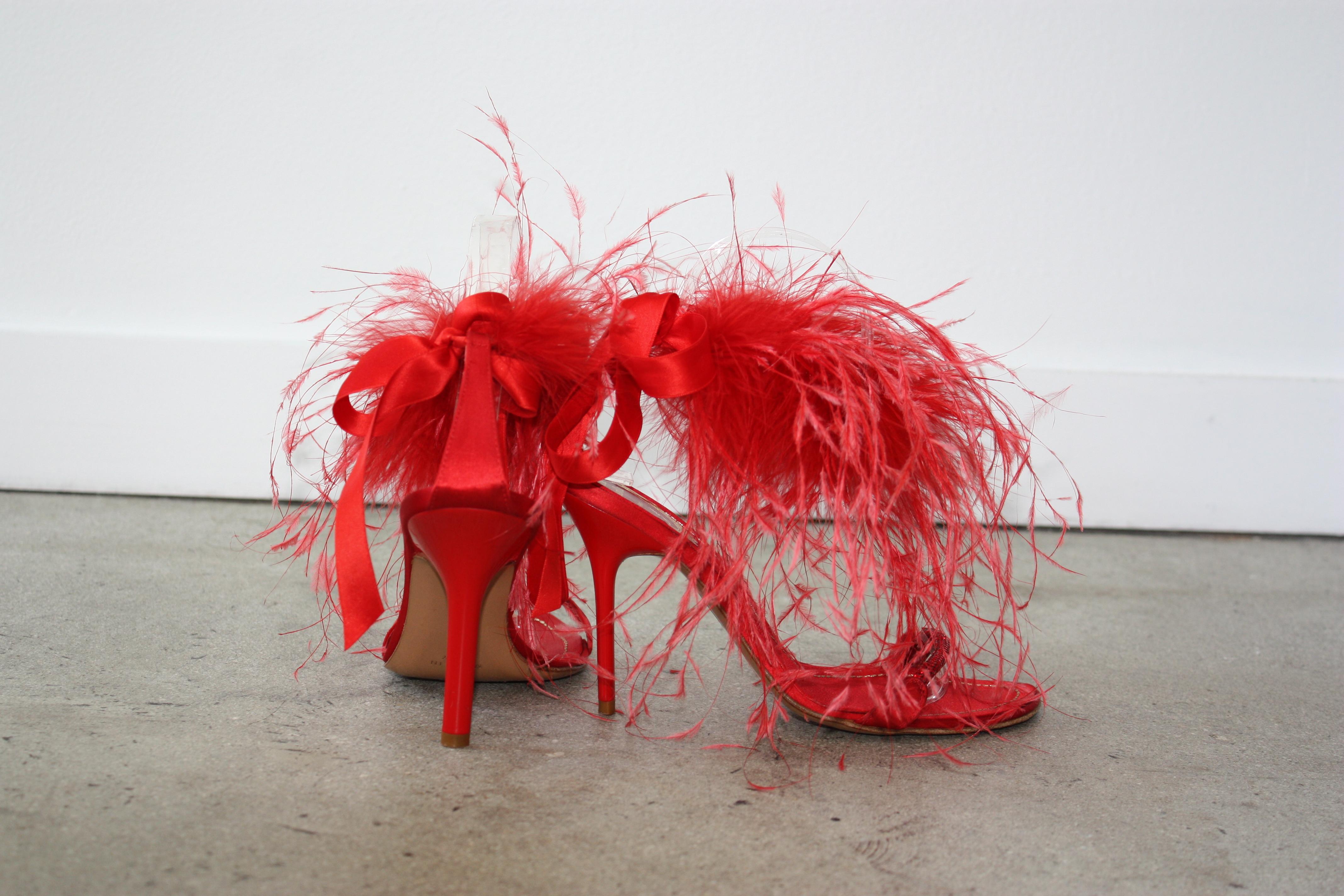 Rene Caovilla RED Satin and Feather Heels Size 37.5 Tonal rhinestone toe strap with feathers surrounding the ankle. Red satin ribbon back ankle tie.
Minor wear to soles. SUPER GLAM !! Perfect for Holidays !!
Size 37 1/2 
Priced to sell quickly ! 