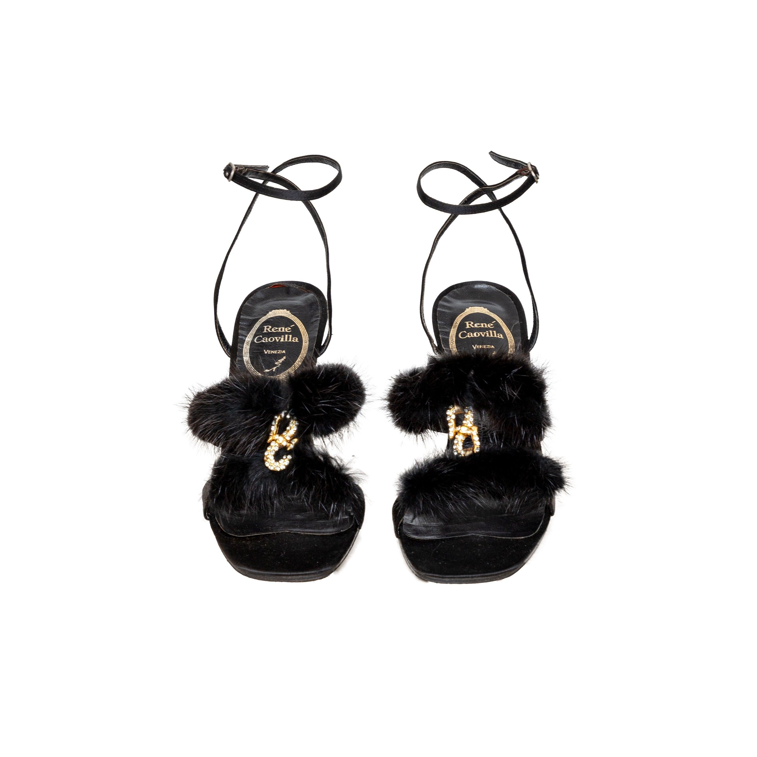 Rene Caovilla sandals blend elegance and chic in plush black fur straps, golden snake accents, and a sleek ankle strap in black leather with satin finish.
 Inclusion: box.
 Remarks: there are some signs of wear on the hardware. 
 Measurement: Insole