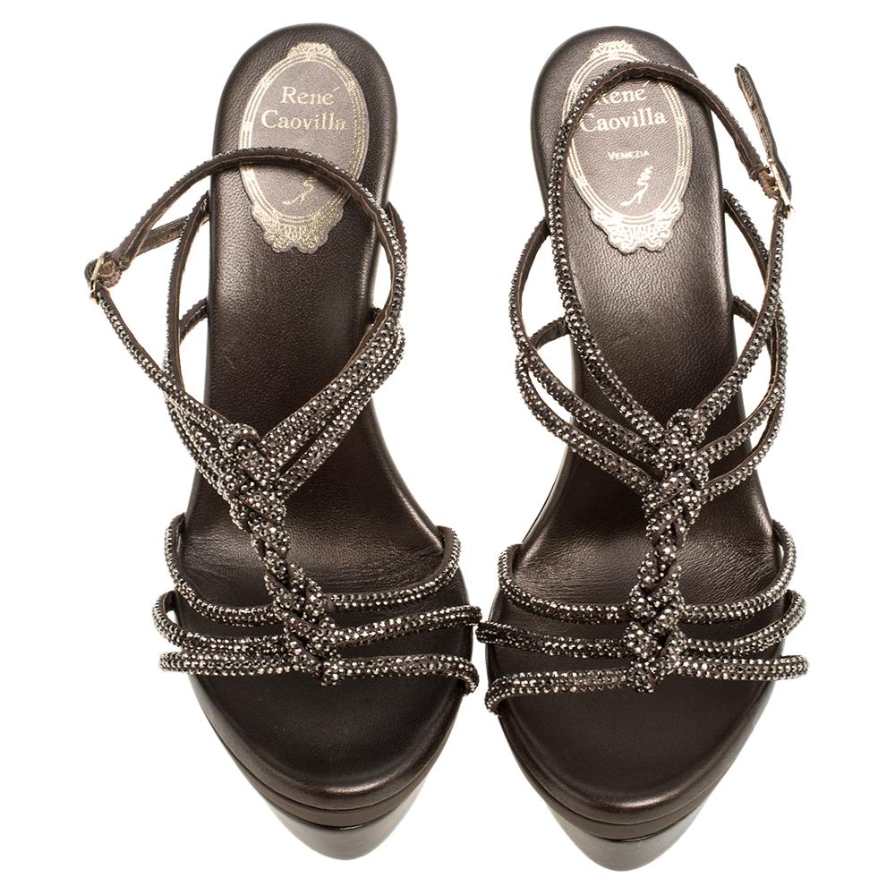 Rene Caovilla is known to create stunning pieces that women all over the globe love. These satin sandals are no exception. Crystal-embellished knotted straps beautifully crown the vamps while 14 cm heels and solid platforms elevate you in the most