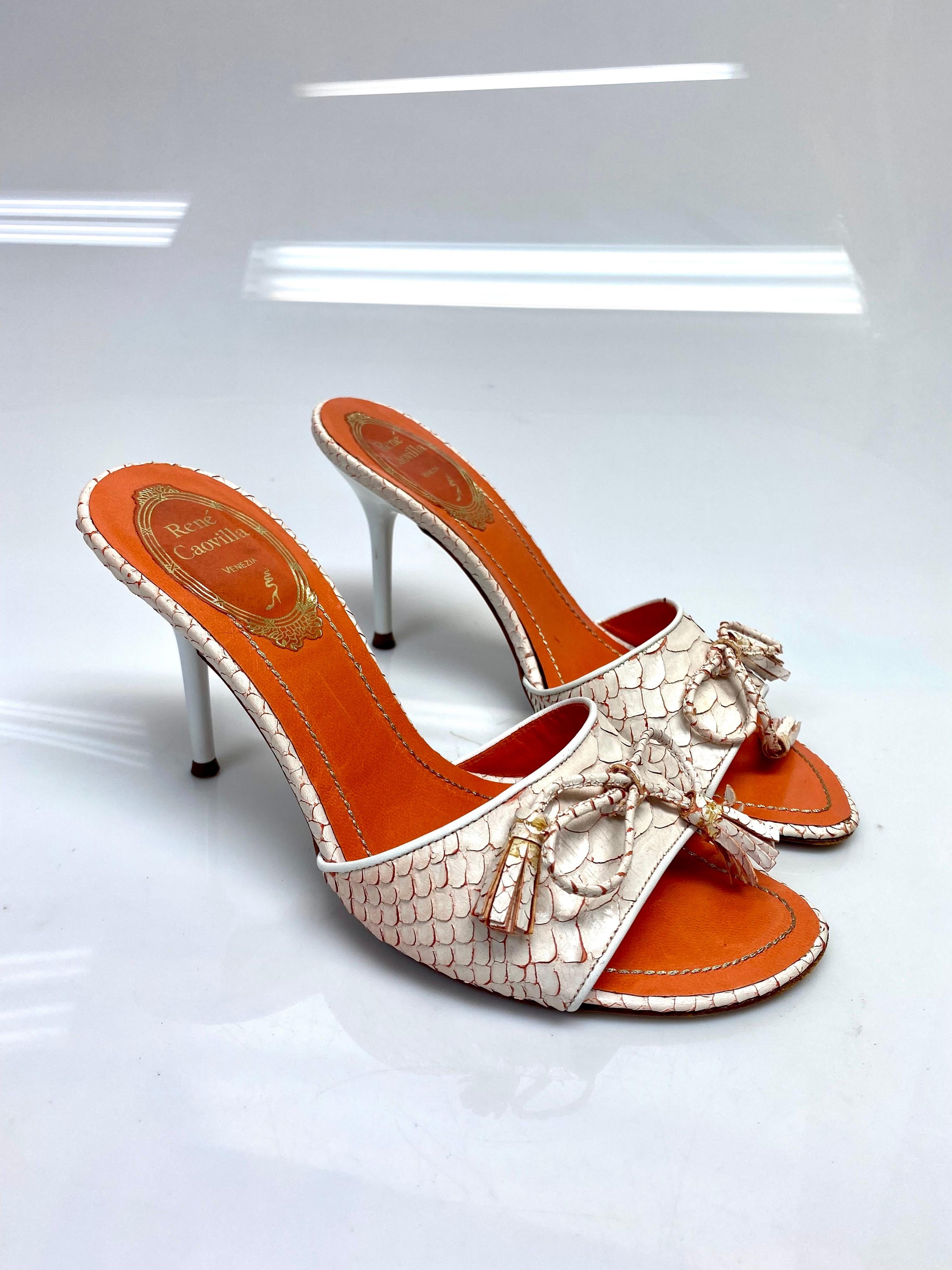 Rene Caovilla Orange Python Peep Toe Heels Size 35. These gorgeous python open toe heels by the iconic Rene Caovilla are an absolute standout. Featuring a bow detail in the front with orange python detailing. Item is in good condition with some