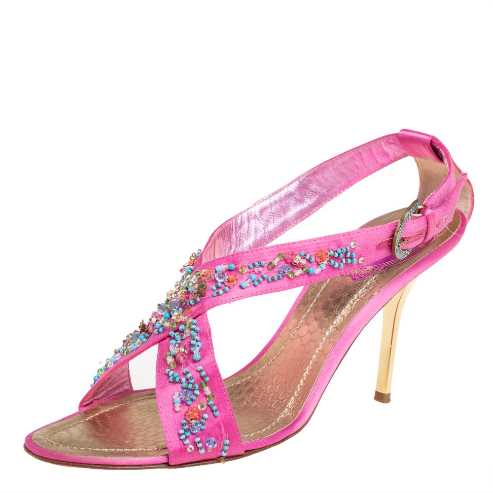 What beauty are these sandals from René Caovilla! Crafted from satin, these pink sandals are fashionable and just right for a glamorous touch. They feature open toes, bead-embellished cross vamp straps, buckled ankle fastening, and 9 cm heels for