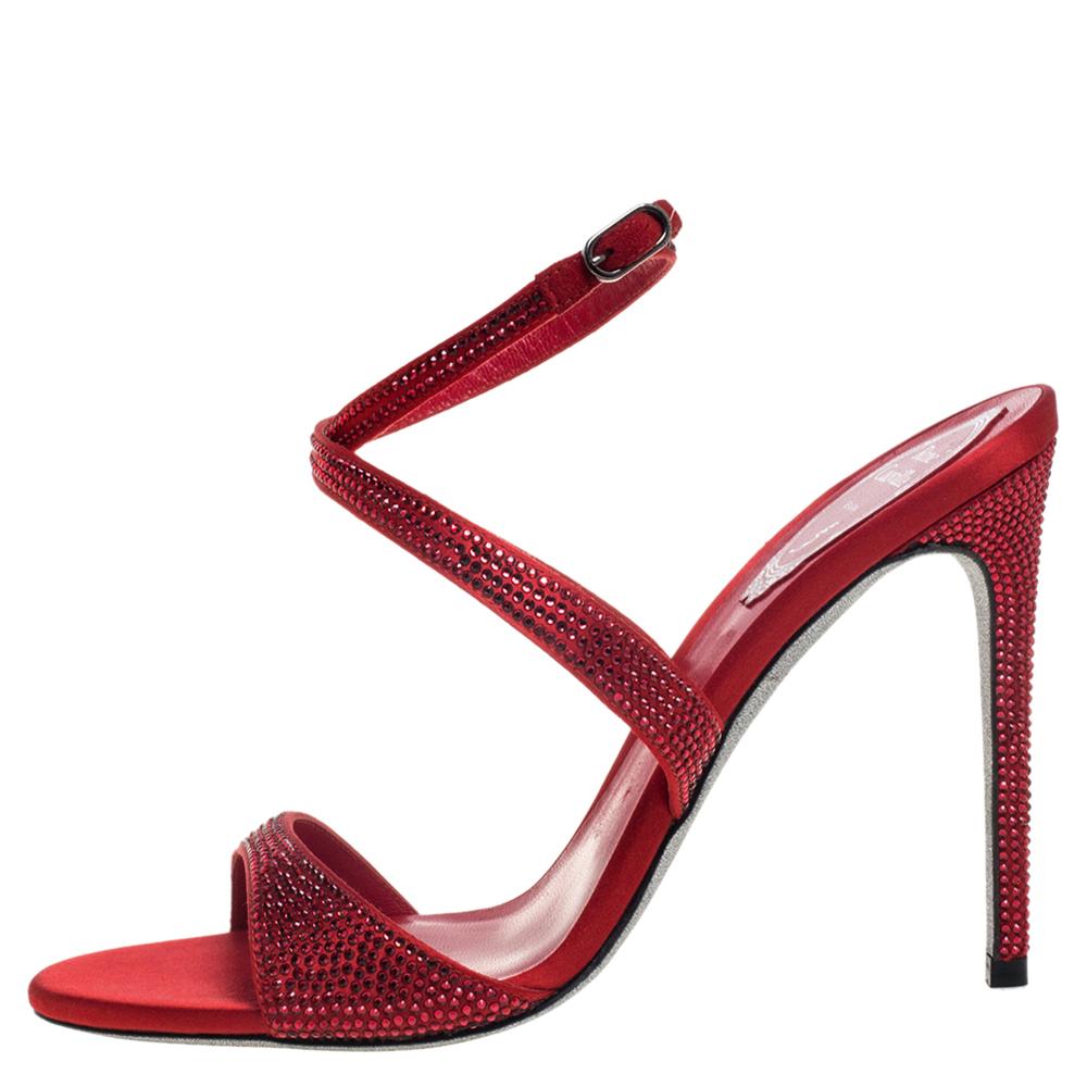 Go bold and glamorous in these stunning sandals from Rene Caovilla! Crafted from red satin, they feature an open toe silhouette with crystal-embellished vamp straps, buckled ankle straps, and 11 cm stiletto heels. They come endowed with comfortable