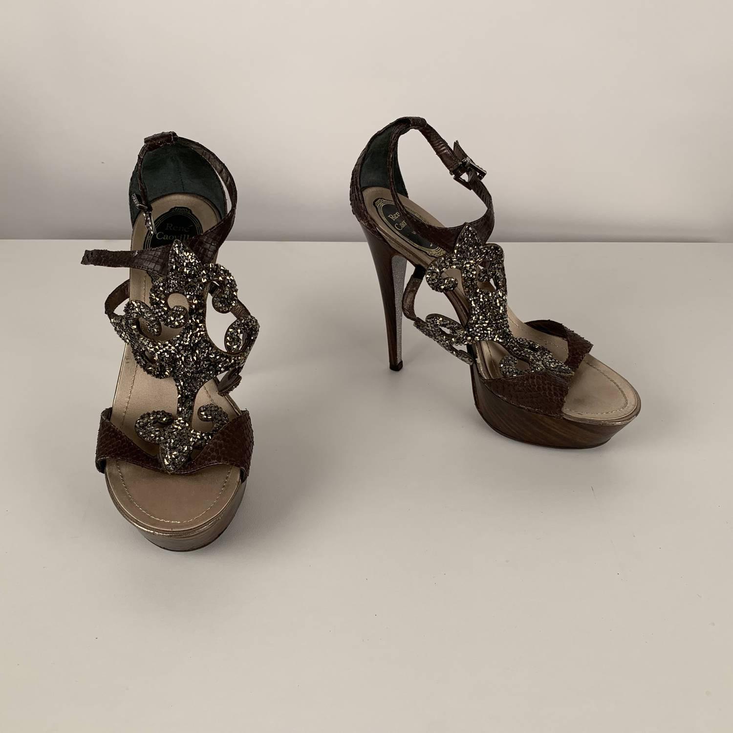 MATERIAL: Leather COLOR: Brown MODEL: Heeled Sandals GENDER: Women SIZE: 38 COUNTRY OF MANUFACTURE: Italy Condition CONDITION DETAILS: B :GOOD CONDITION - Some light wear of use - some rhinestones are missing, some wear of use on leather (on the