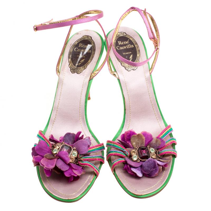 Brought to life with utmost elegance, these Rene Caovilla sandals will enchant every eye that captures their beauty! They have been crafted from satin in an open toe silhouette and styled with crystal embellished flower motifs on the vamps. They