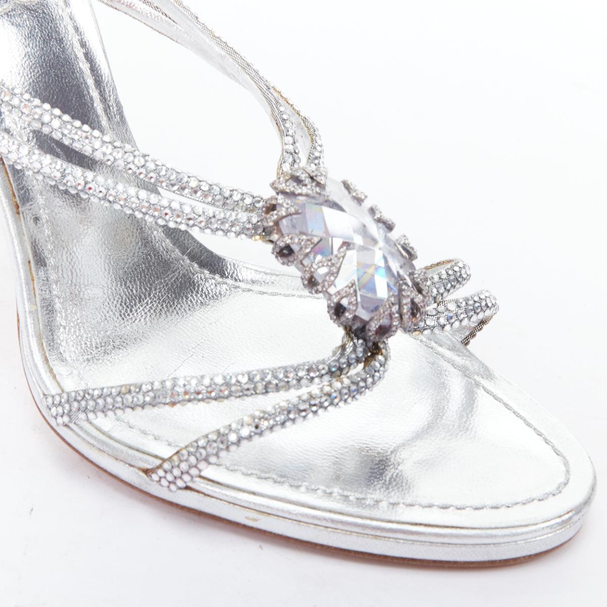 RENE CAOVILLA silver leather rhinestone crystal heel sandal EU37.5
Reference: TGAS/E00213
Brand: Rene Caovilla
Material: Leather
Color: Silver
Pattern: Solid
Closure: Slip On
Lining: Silver Leather
Extra Details: Large crystal embellishment at
