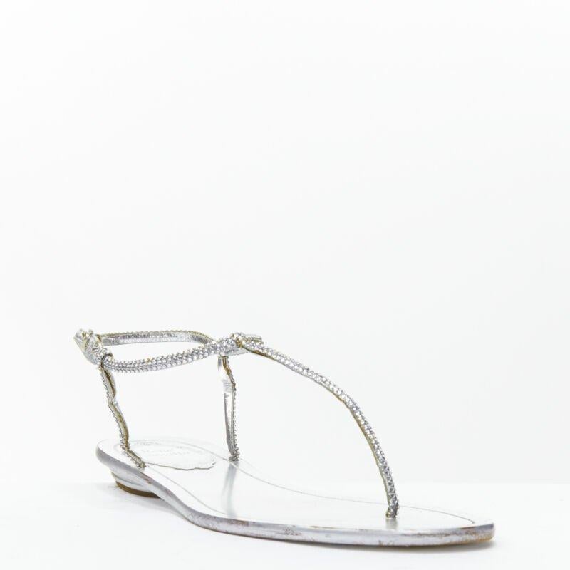 RENE CAOVILLA silver strass rhinestone T-strap flat thong sandals EU36
Reference: MELK/A00215
Brand: Rene Caovilla
Material: Leather
Color: Silver
Pattern: Solid
Closure: Buckle
Lining:  Leather
Made in: Italy

CONDITION:
Condition: Good, this item