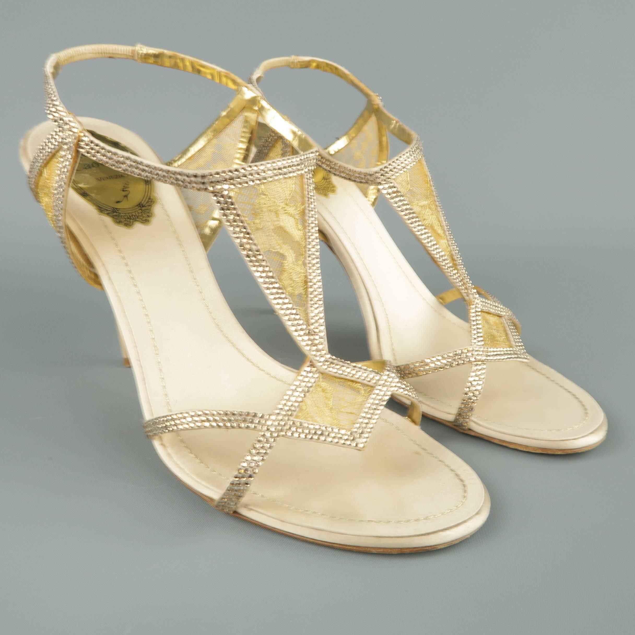 RENE CAOVILLA evening sandals come in a champagne silk satin and feature geometric harness straps with crystal embellishments, gold silk panels, and beige lacquered  stiletto heel. Wear on heels. As-is. Made in Italy.
 
Fair Pre-Owned