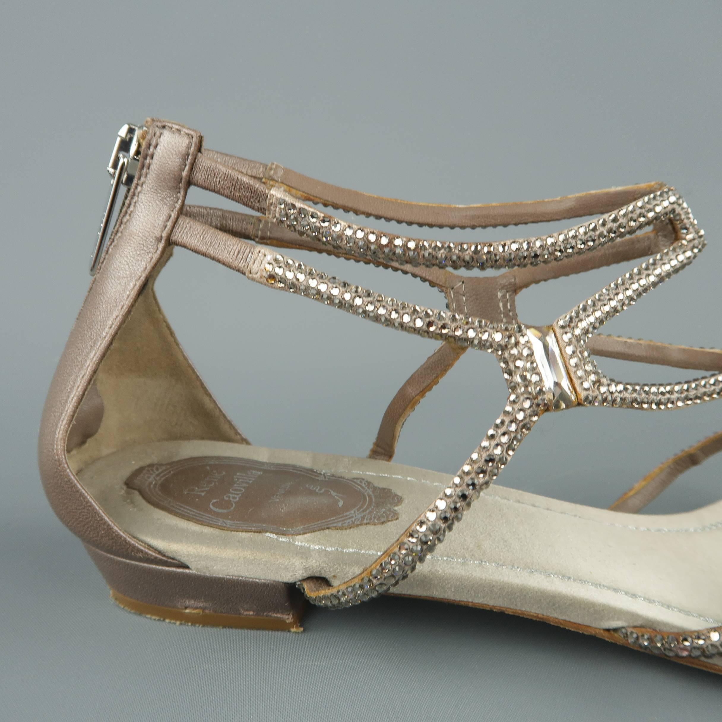 RENE CAOVILLA sandals come in tape suede and satin with a back zip closure and rhinestone studded cage strap front. Made in Italy.
 
Good Pre-Owned Condition.
Marked: IT 39.5
 
Outsole: 10 x 3.5 in.
