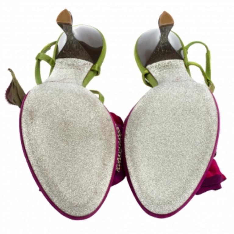 Beautifully crafted to perfection, these sandals from the House of René Caovilla will bring effortless charm and femininity to your feet! They are made from multicolored snakeskin leather, which is accentuated with satin flower appliques. These