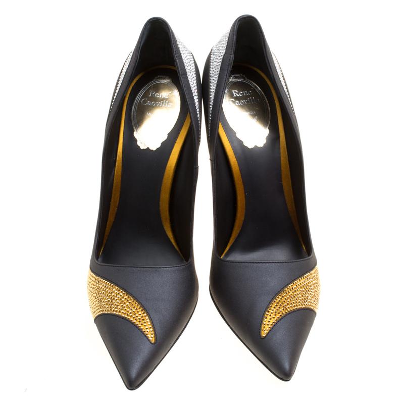 Add a touch of glamour to your look by slipping into this sleek pair of pumps from René Caovilla. A splendid combo of comfort and style, these are made out of leather and shaped as pointed toes with 12 cm heels. The pumps are complete with gold and