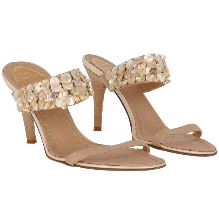 Renè Caovilla beige 2000s rope sandals. Double front bands decorated with mother of pearl details and shells. Stiletto heels.

Size: 37 IT

Measurements
Insole lenght: 24 cm
Heel: 9 cm

Product code: X5267

Notes: The item shows slight signs of