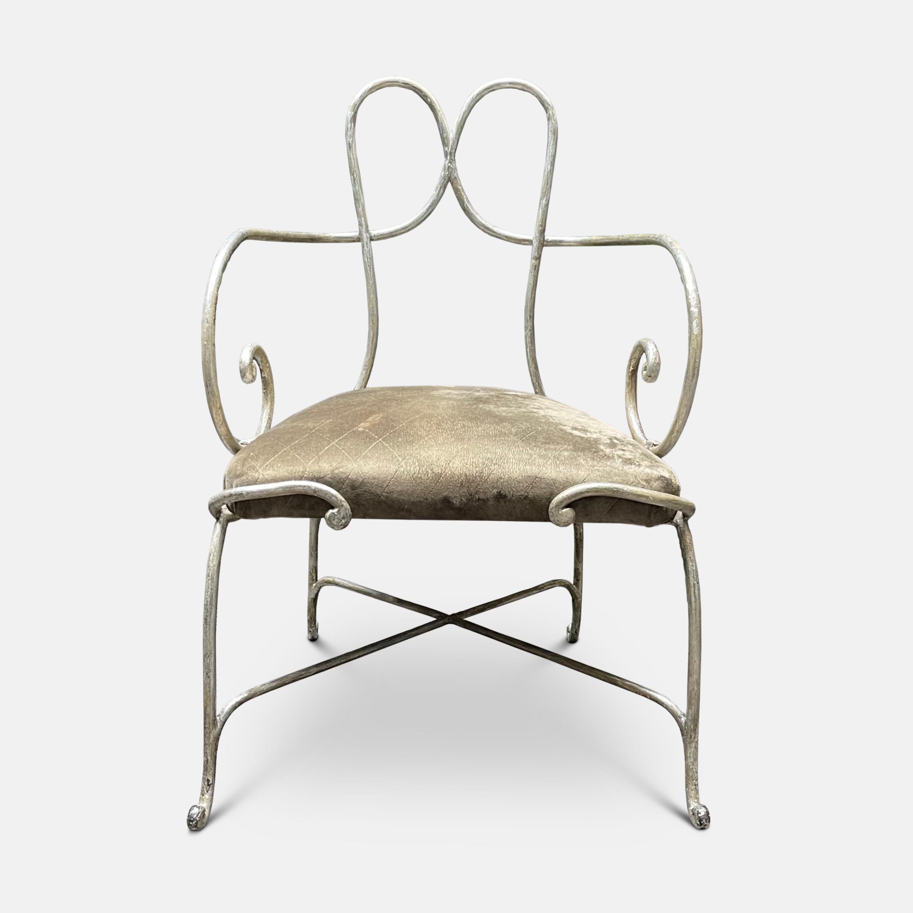 A  1940’s forged metal armchair by  René Drouet finished in patinated silver. 

Provenance: Collection Claude Montana Literature: Architectural Digest, septembre 1989. Claude Montana An Avant-Garde Elegance on the Left Bank. Pages 120 -