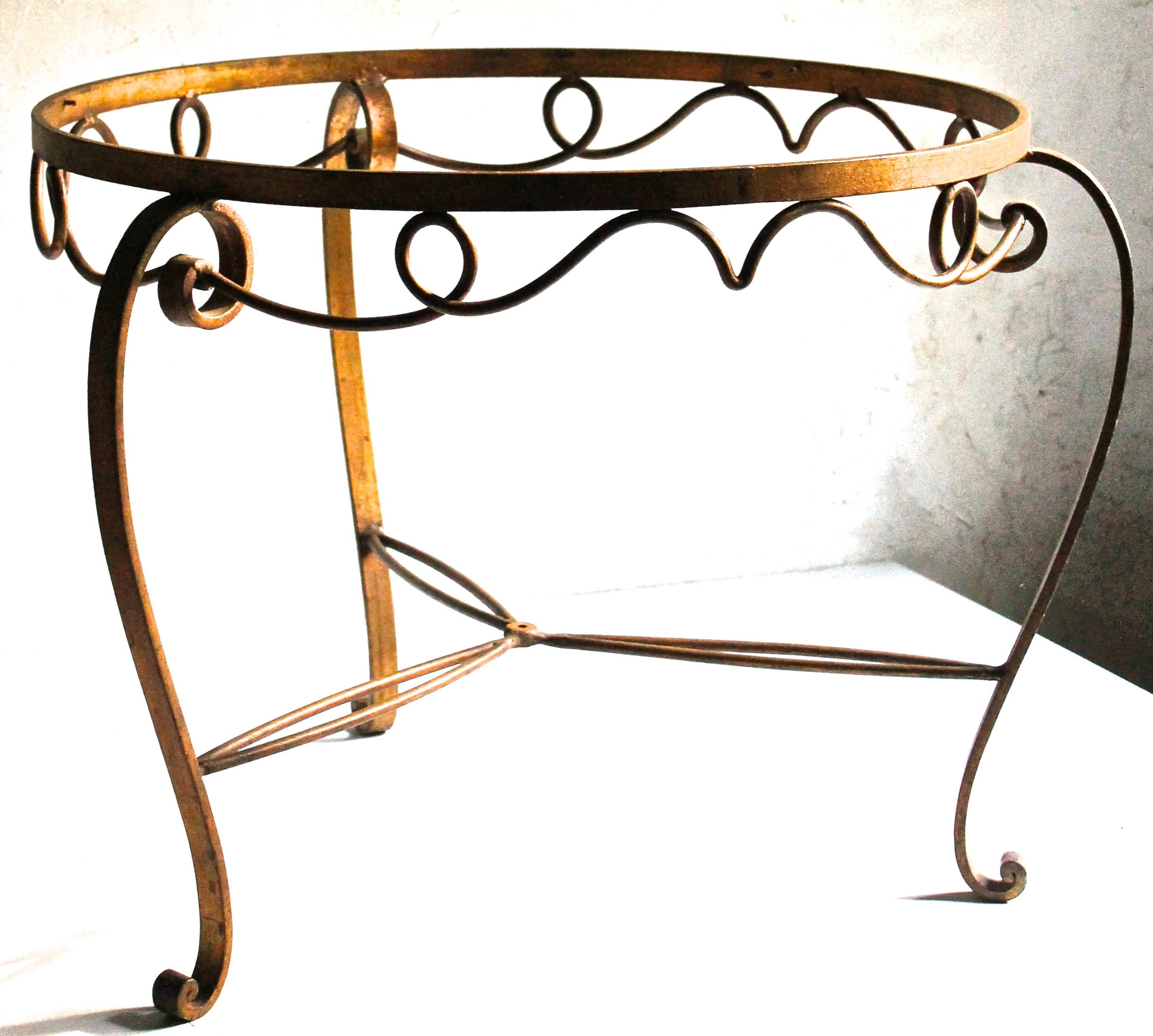 A beautiful and gracefully formed low table in the French 1940s style of Rene Drouet and Rene Prou.