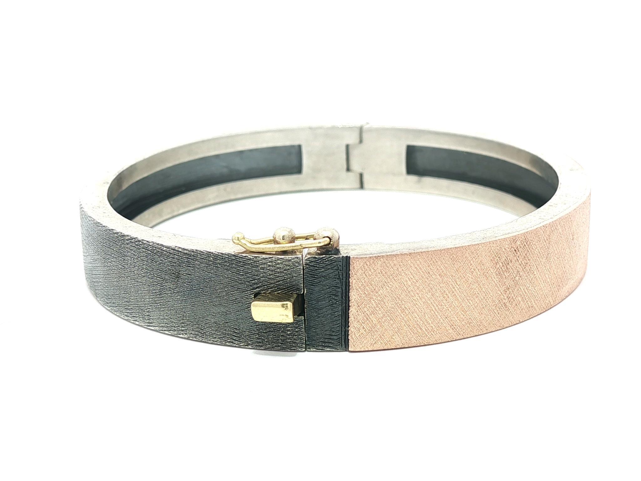 --Stone(s):--
(1) Natural Genuine Diamond - Round Brilliant Cut - Burnish Set - Nice Brilliant White Diamond - 0.25ct (approx.)

Material: Solid Sterling Silver w/ 18k Rose Gold
Weight: 44.49 Grams
Type: Hinged Bangle Bracelet
Size: Will comfortably