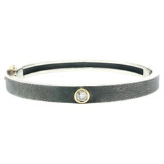 Rene Escobar Silver 
18k Yellow Gold Clasp 
Bezel Diamond Florentine Bangle