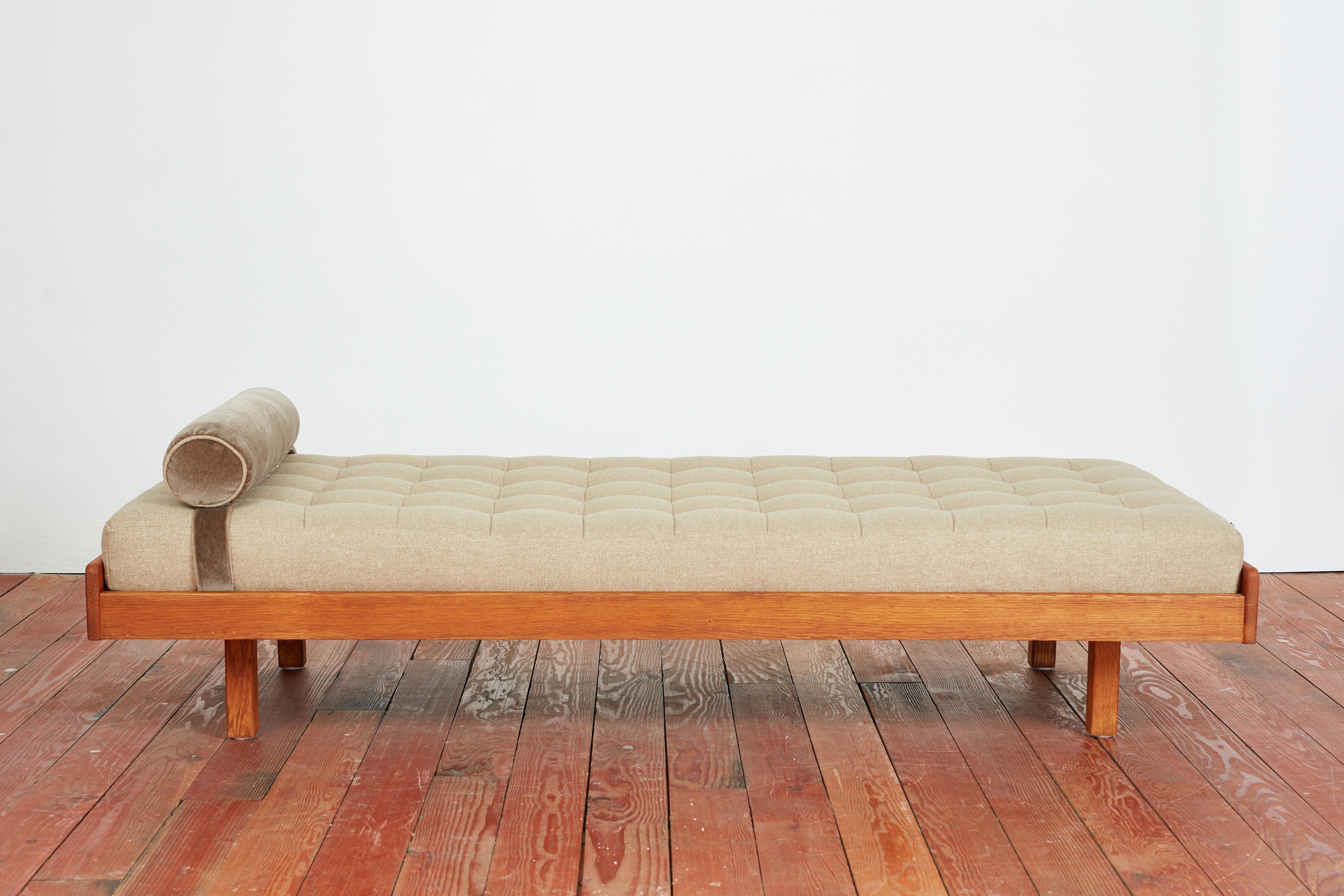 Rene Gabriel attributed daybed with simple oak frame and recessed legs. 
Wonderful patina.
New cushion upholstered in thick beige linen with sleek mohair bolster. 