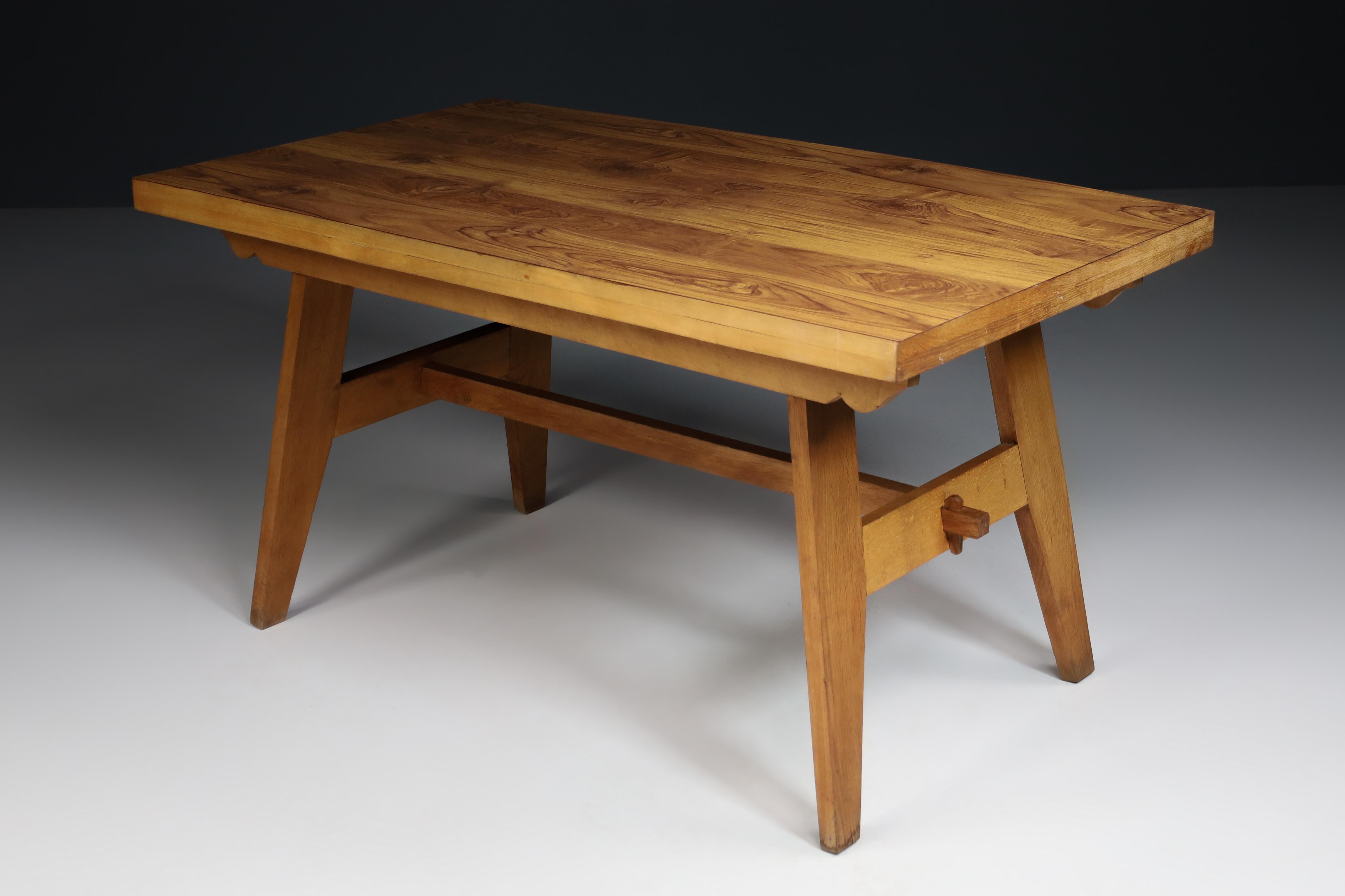 René Gabriel blond oak reconstruction table, France 1945. 

René Gabriel put himself at the service of French Reconstruction from the 1940s; he designed furniture intended to be produced in large series, using local wood species such as oak,