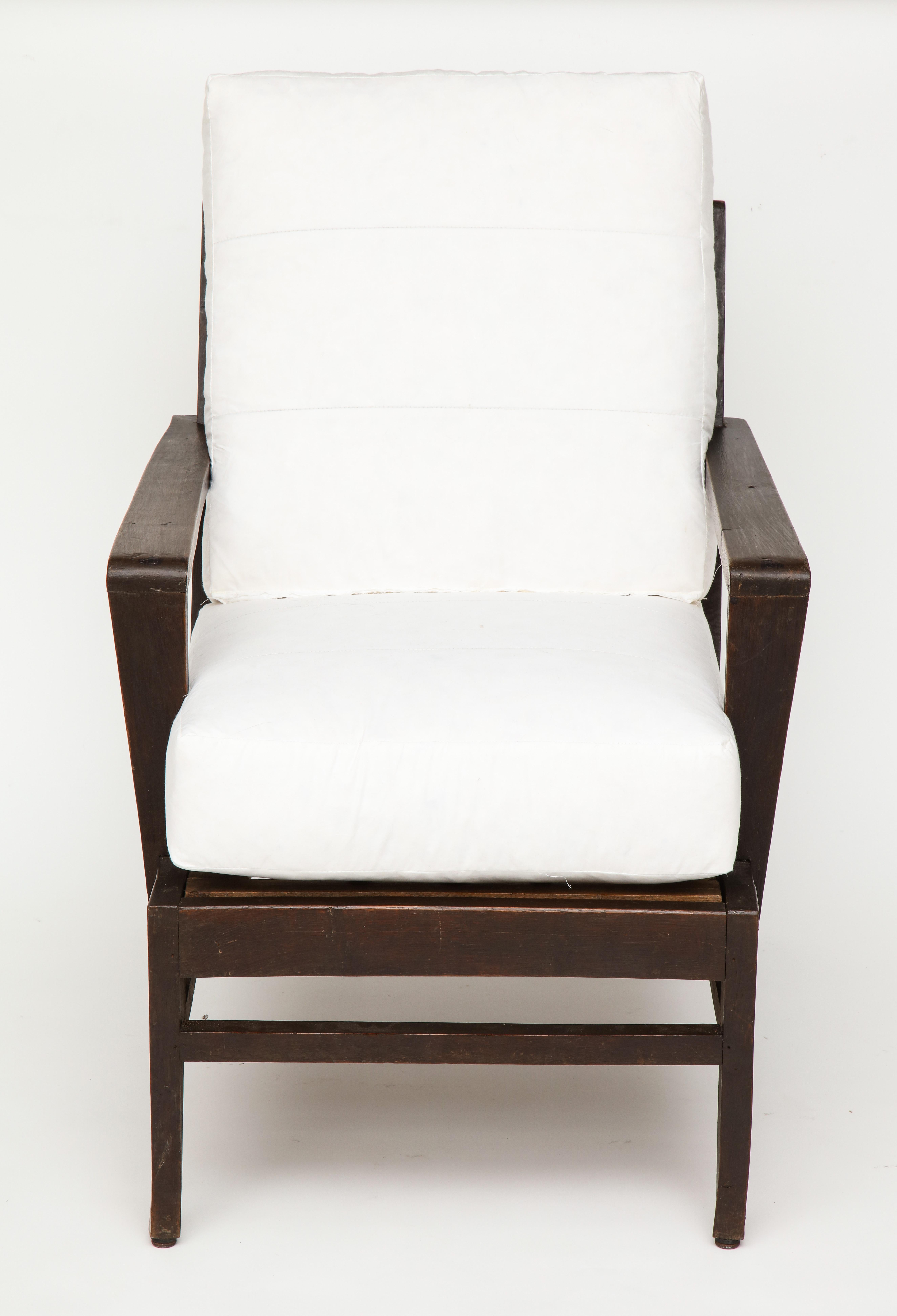 wooden chair with white cushion