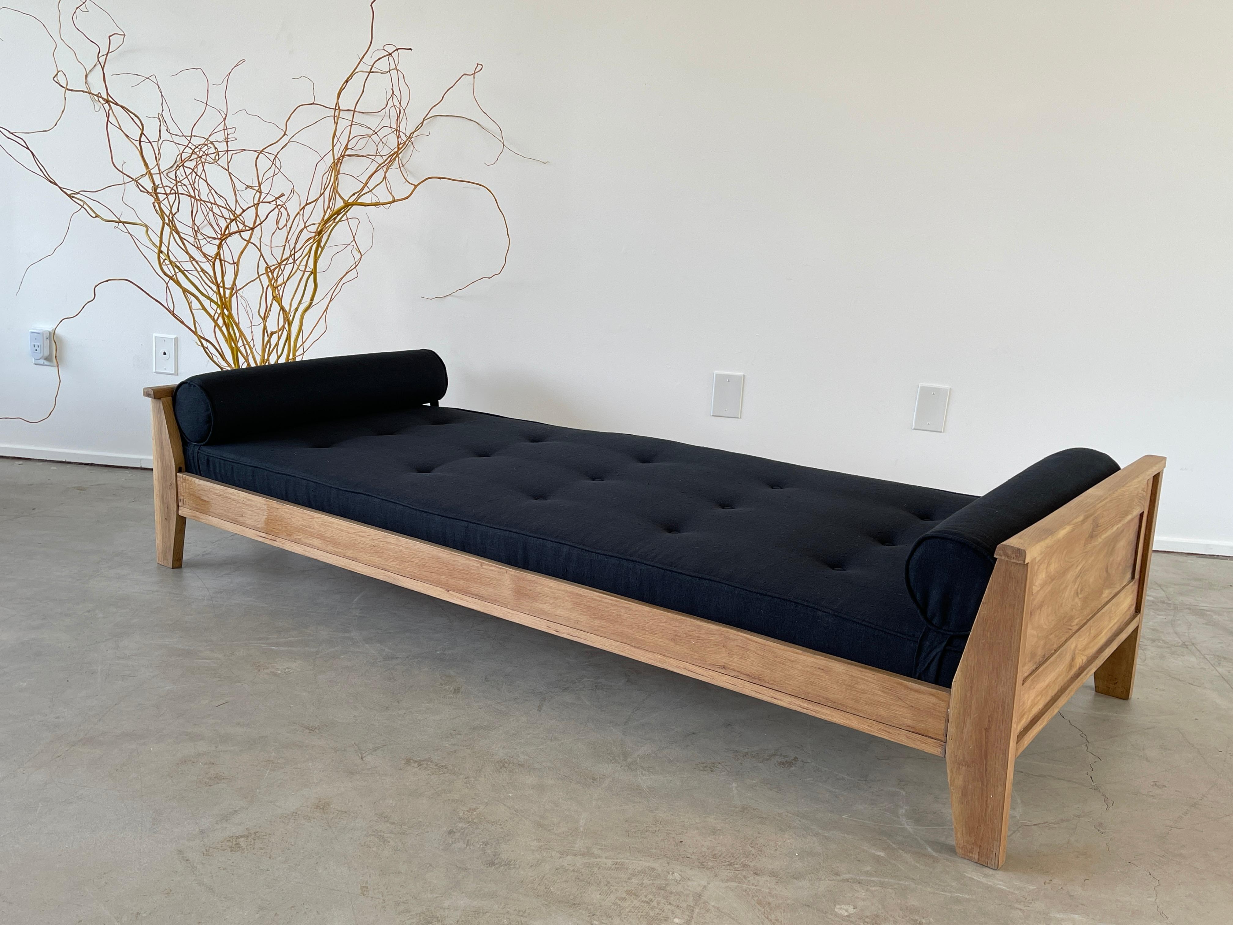 Wonderful oak daybed by Rene Gabriel with newly upholstered black linen cushion and bolsters at both ends. 
Great angular shape.