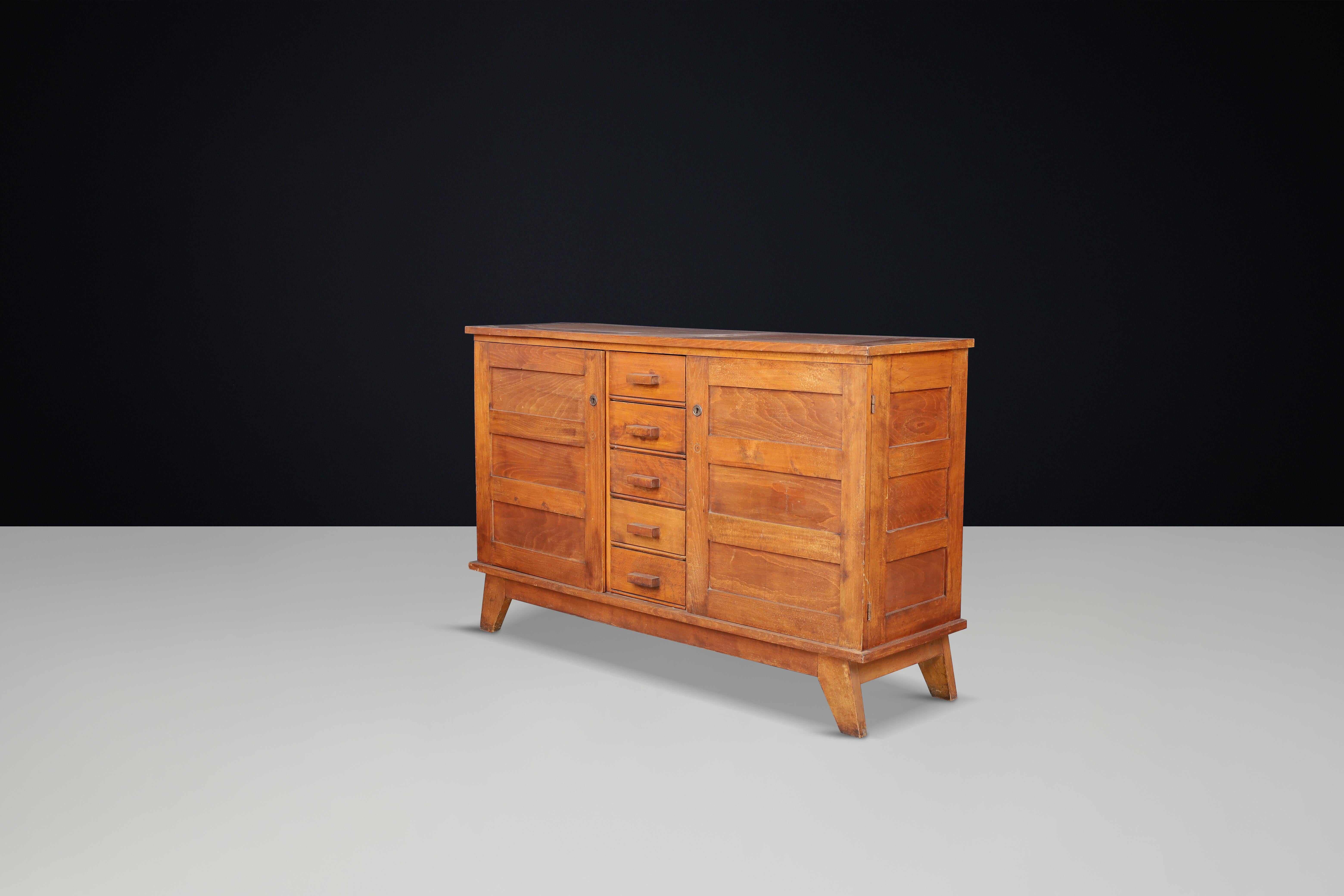 René Gabriel Patinated Oak Sideboard, France, 1940s

This mid-century sideboard, crafted from patinated French oak, was designed by René Gabriel in the 1940s in France. It was part of a collection of emergency furniture created for war victims,