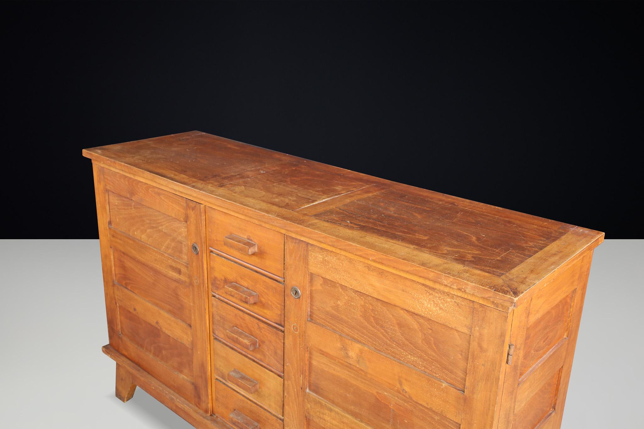 René Gabriel Patinated Oak Sideboard, France, 1940s

This mid-century sideboard, made from patinated French oak, was designed by René Gabriel in the 1940s in France. It was part of a collection of emergency furniture created for war victims, which